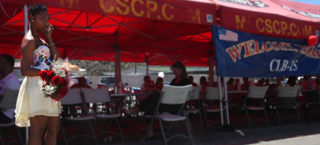 A Combat Logistics Battalion 15 spouse waits for her loved one to return during CLB-15’s homecoming aboard Camp Pendleton, Calif., May 13, 2013. Several Marines and sailors returned from an eight-month deployment with the 15th Marine Expeditionary Unit. (U.S. Marine Corps photo by Cpl. Laura Gauna/Released)