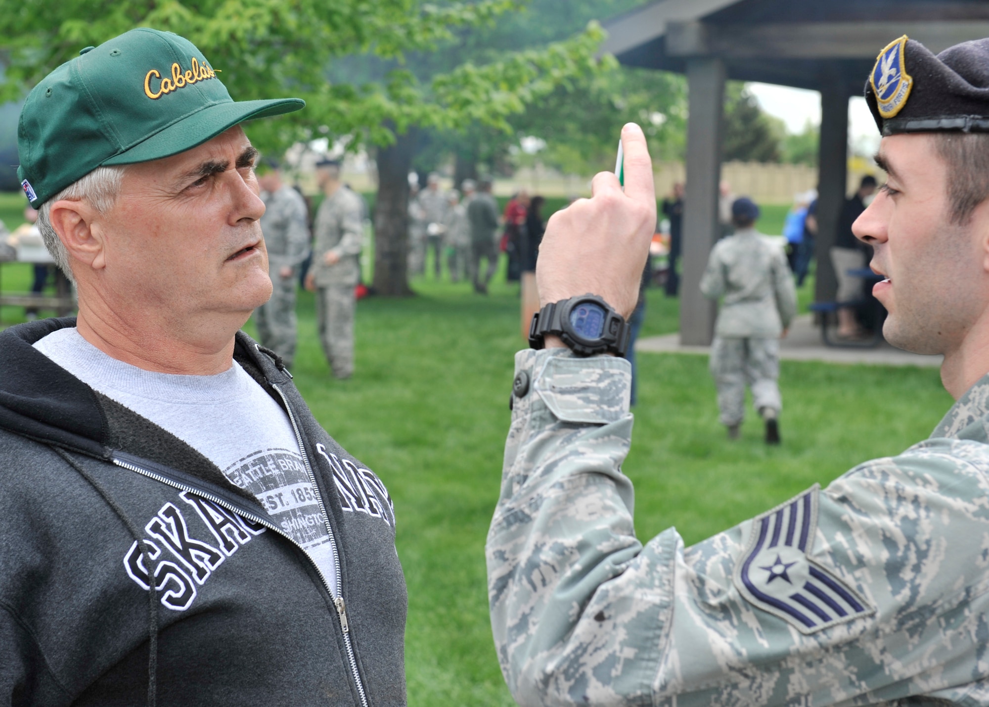 Lt. Cmdr. Kenneth Simmet, 92nd Medical Operations Squadron Mental Health Flight, performs a field sobriety test administered by Staff Sgt. James Terry, 92nd Security Forces Squadron installation patrolman, during a simulated driving under the influence demonstration at Fairchild Air Force Base, Wash., May 16, 2013. (U.S. Air Force photo by Staff Sgt. Michael Means/Released)