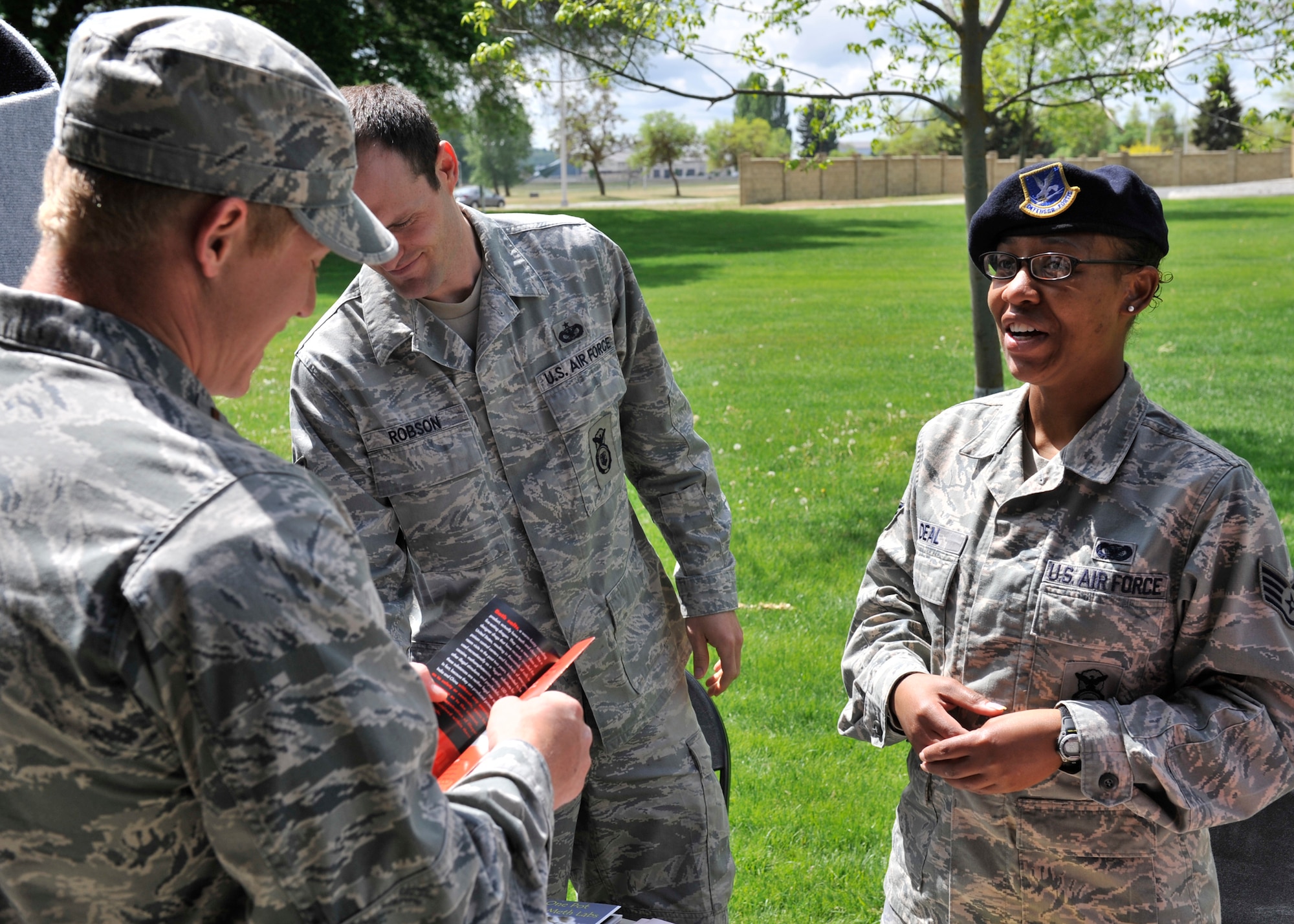 Staff Sgt. Denine Deal, 92nd Security Forces Squadron installation patrolman, speaks to 2nd Lt. Conner Vafossen, 92nd Contracting Squadron contract specialist, at the SF booth at Fairchild Air Force Base, Wash., May 16, 2013. Booths from several base agencies were set-up to speak to Airmen about the consequences of driving under the influence and steps they can take to prevent it. (U.S. Air Force photo by Staff Sgt. Michael Means/Released)