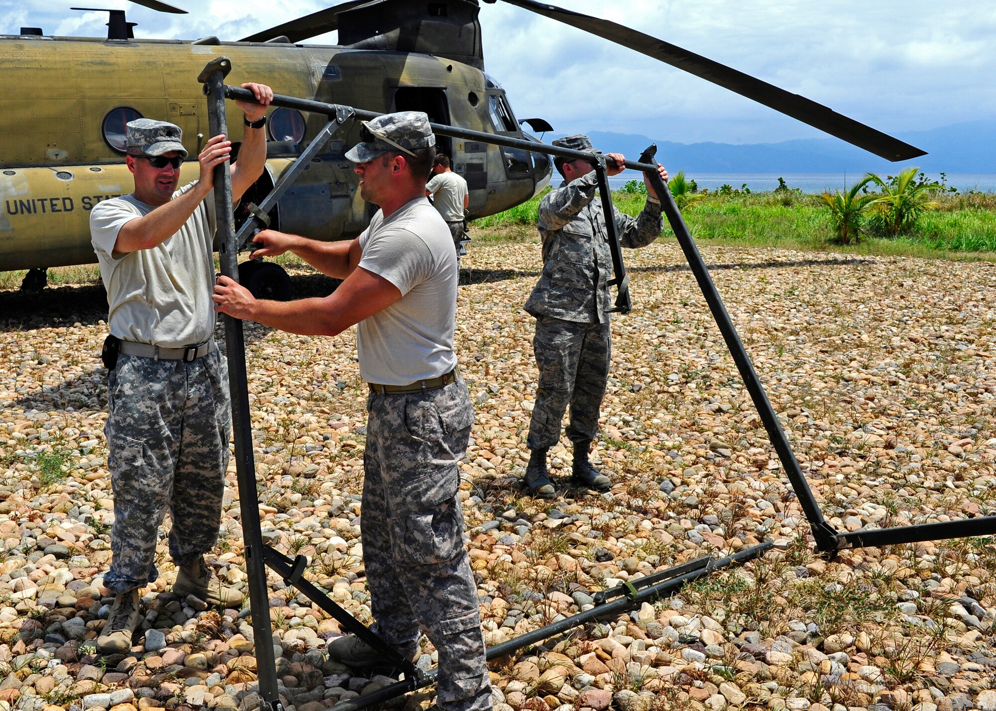 United States Army Lt. Col. Jay Liddick, CENTAM Survey and Assessment Team leader, U.S. Army 1st Lt. Chad Wallway, C-SAT member and U.S. Air Force Capt. Scott Gaught, C-SAT member, set up a tent after arriving in Puerto Castilla, Honduras, for a simulated hurricane disaster response exercise, May 15. The C-SAT team responds to a natural disaster and humanitarian assistance notification in the Central America Region to conduct an assessment of the area before military forces are deployed.(Air Force photo by Staff Sgt. Eric Donner)