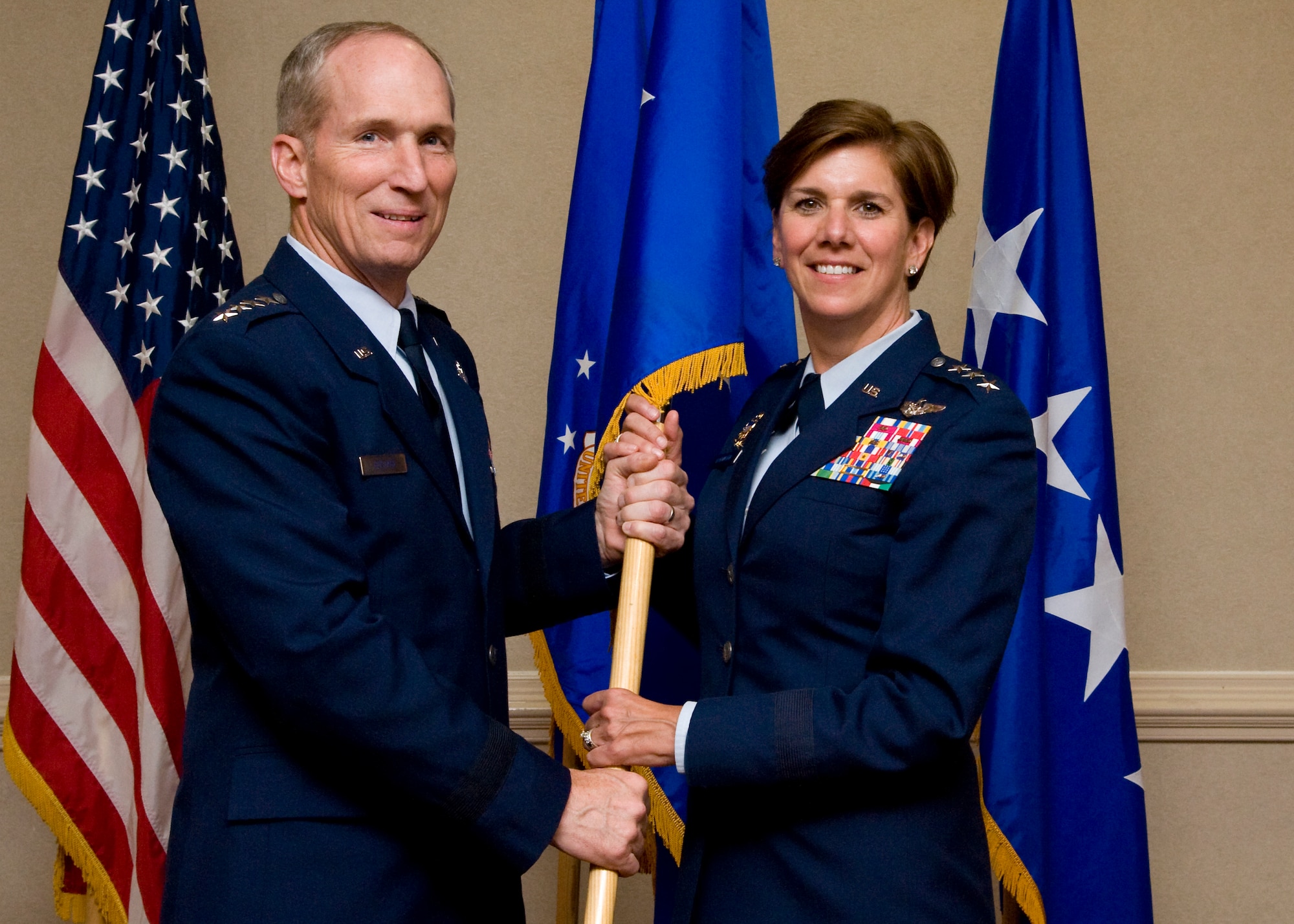 U.S. Air Force Maj. Gen. Lori J. Robinson is promoted to the rank of lieutenant general by Gen. Mike Hostage, commander of Air Combat Command, during a ceremony at Langley Air Force Base, Va., May 17.  Robinson will become the ACC vice commander May 21, when she replaces Lt. Gen. William J. Rew, who is retiring. (U.S. Air Force photo by Staff Sgt. John Strong/Released)
