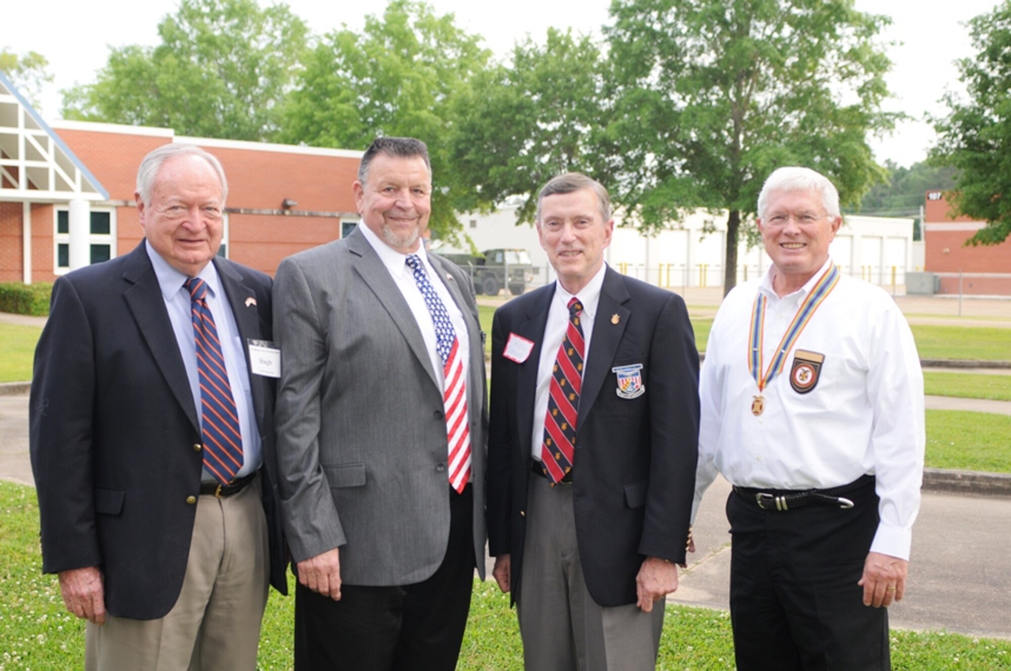 Hugh Hart (far left) a Korean War Marine Officer and State President of the MOWW stands along side former American Vietnam War POW's, Col (Ret.) Ken Cordier (second from left) and Capt. (Ret.) Bill Robinson (2nd from right) and Maj. Gen. (Ret.) Erik Hearon (far right).  The two former POW's were special guests at Thompson Field on May 16, 2013.