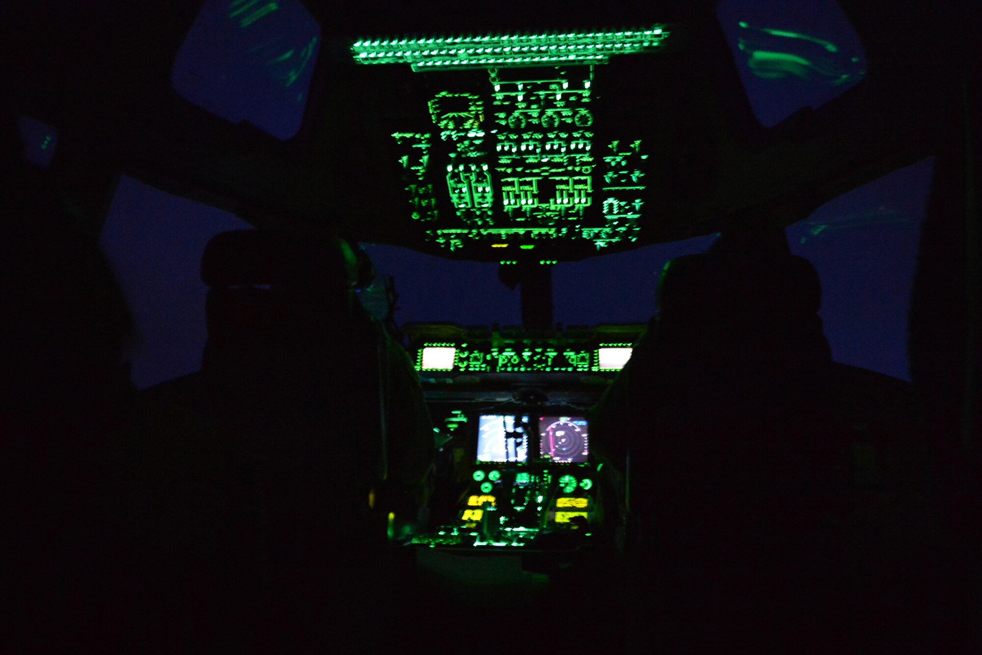 Pilots assigned to the 62nd and 446th Airlift Wings at Joint Base Lewis-McChord, Wash., perform nighttime formation flying during a training mission May 14, 2013. The pilots utilized the darkness to perform landings using night vision goggles. (U.S. Air Force photo/Airman 1st Class Jacob Jimenez)