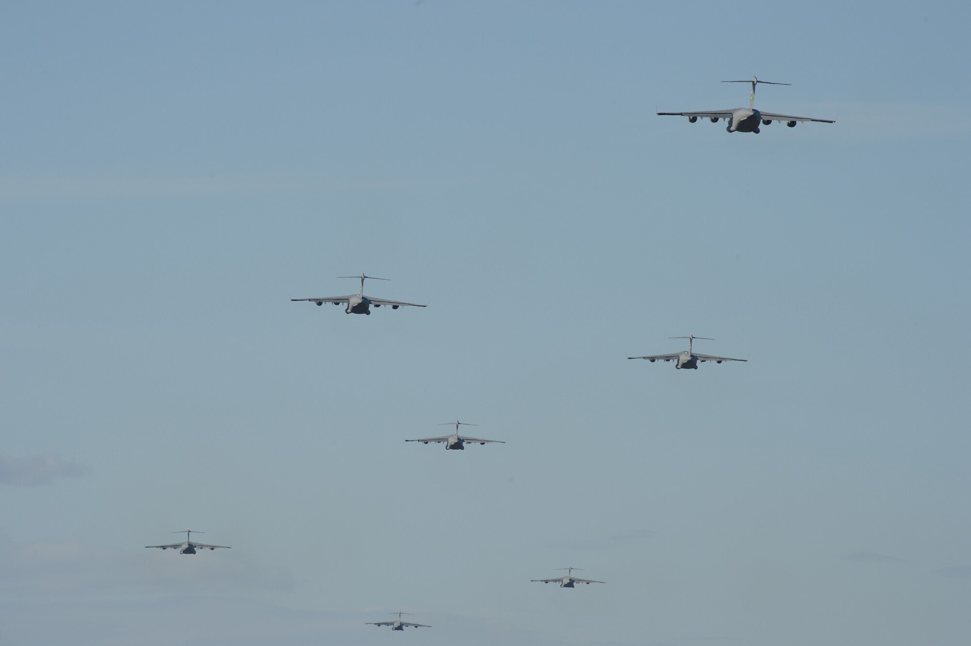 Seven C-17 Globemaster III aircraft fly east of Joint Base Lewis-McChord, Wash., after performing a low-level pass during a training mission May 14, 2013. During the mission, 300 requirements were met to keep loadmasters and pilots certified. (U.S. Air Force photo/Staff Sgt. Frances Kriss)
