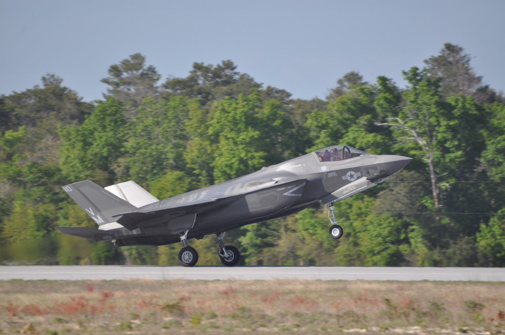 United Kingdom pilot, Lt. Cmdr. Ian Tidball, became the first Royal Navy
student-pilot to fly a sortie in the F-35B Lightning II April 10 at Eglin
Air Force Base, Fla. Tidball lands after a successful first flight. The Eglin Royal Navy F-35B pilots fly with the Marine unit. Tidball's has flight experience in the British Sea Harrier and the F-18 Super Hornet. (U.S. Air Force photo/Maj. Karen Roganov)
