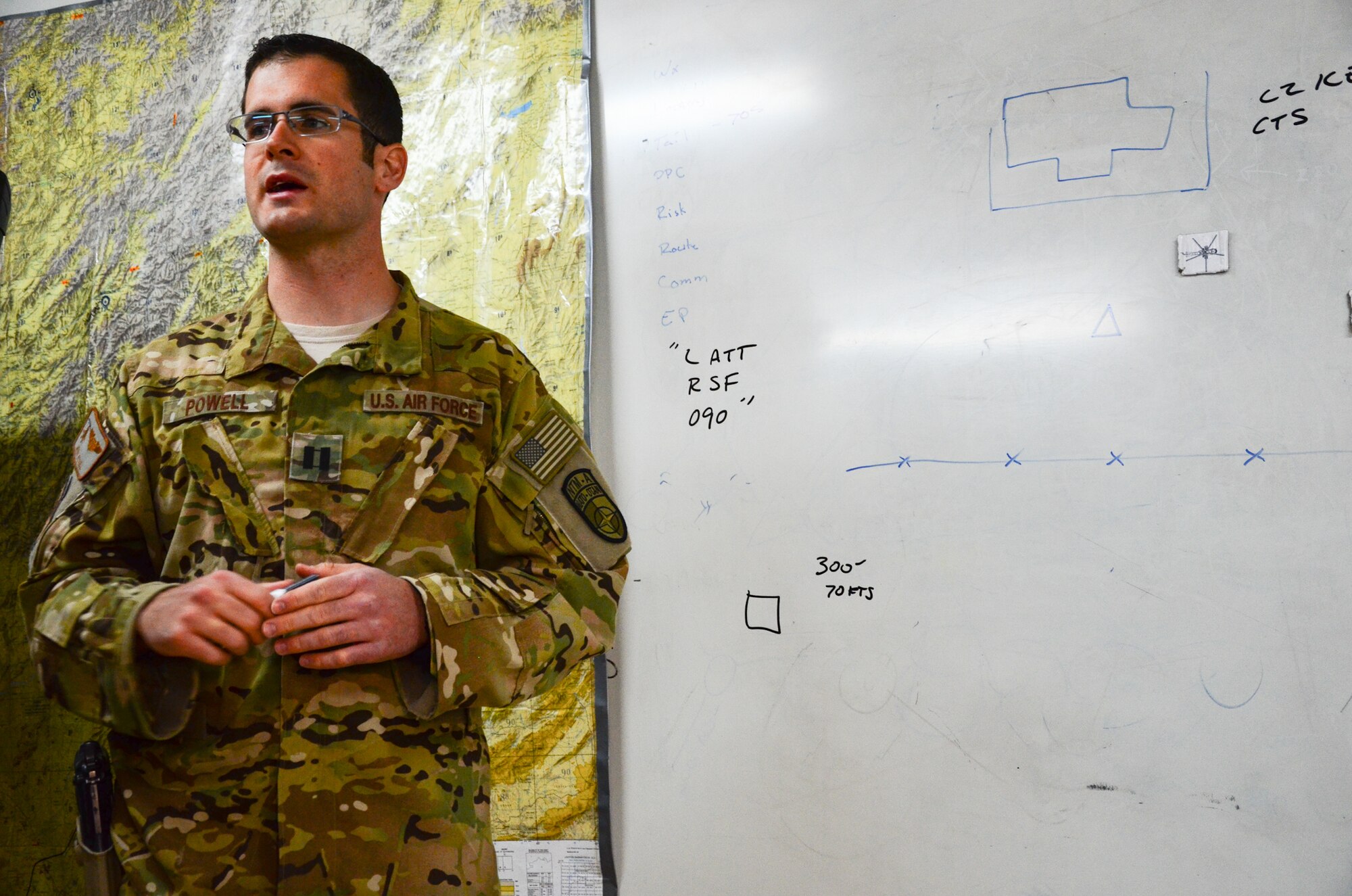 KANDAHAR, Afghanistan – U.S Air Force Capt. Jeremy Powell, 441st Air Expeditionary Advisor Squadron pilot advisor, provides a mission briefing to two Afghan Air Force MI-17 helicopter flight crews at Kandahar Airfield May 6, 2013. Powell is one of approximately 15 air advisors, who provide training and expertise to help build the AAF’s capacity to project combat airpower today and in the future. (U.S. Air Force photo/1st Lt Tony Richardson)