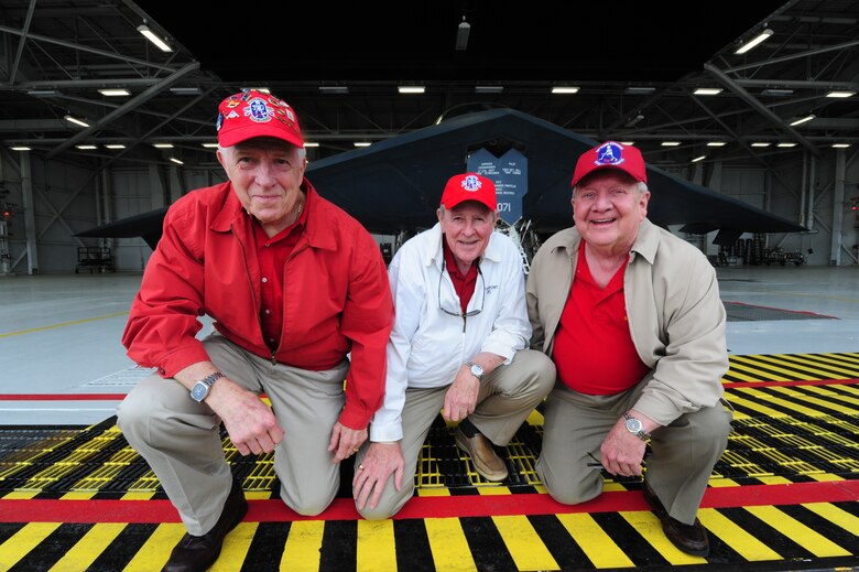 Robert Butterfield, Charlie Brown and Robert Parks, all retired 13th Bomb Squadron members, united to view the unveiling of the name one of their fallen comrades, which was painted on one of the doors of a B-2 Spirit at Whiteman Air Force Base, May 10, 2013. As one of the oldest bomb squadrons in Air Force history, the 13th BS has flown in combat during World Wars I and II, Korea, Vietnam and Southwest Asia. (U.S. Air Force photo by Staff Sgt. Nick Wilson/Released)