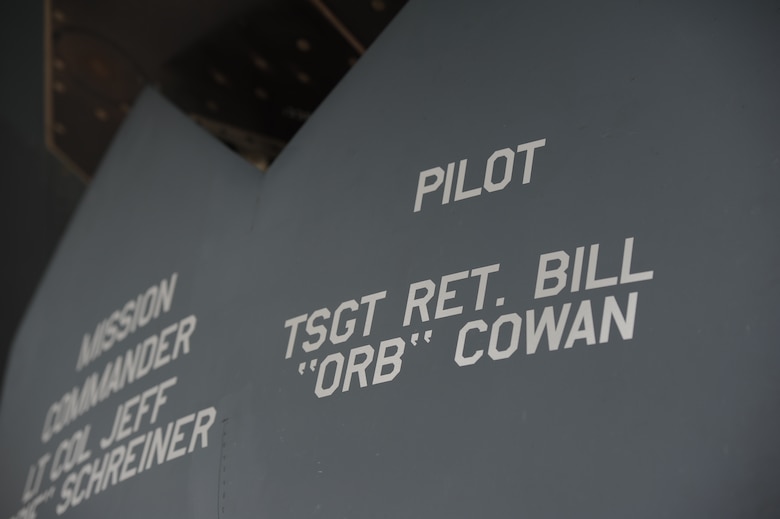 A painting is unveiled in honor of Tech. Sgt. Bill Cowan, a retired member of the 13th Bomb Squadron, at Whiteman Air Force Base, May 10. 2013. Since Cowan recently passed away, the painting was provided in respect for his contributions to the 13th BS. Cowan was instrumental in ensuring the 13th BS returned to active status in 2000. (U.S. Air Force photo by Staff Sgt. Nick Wilson/Released)