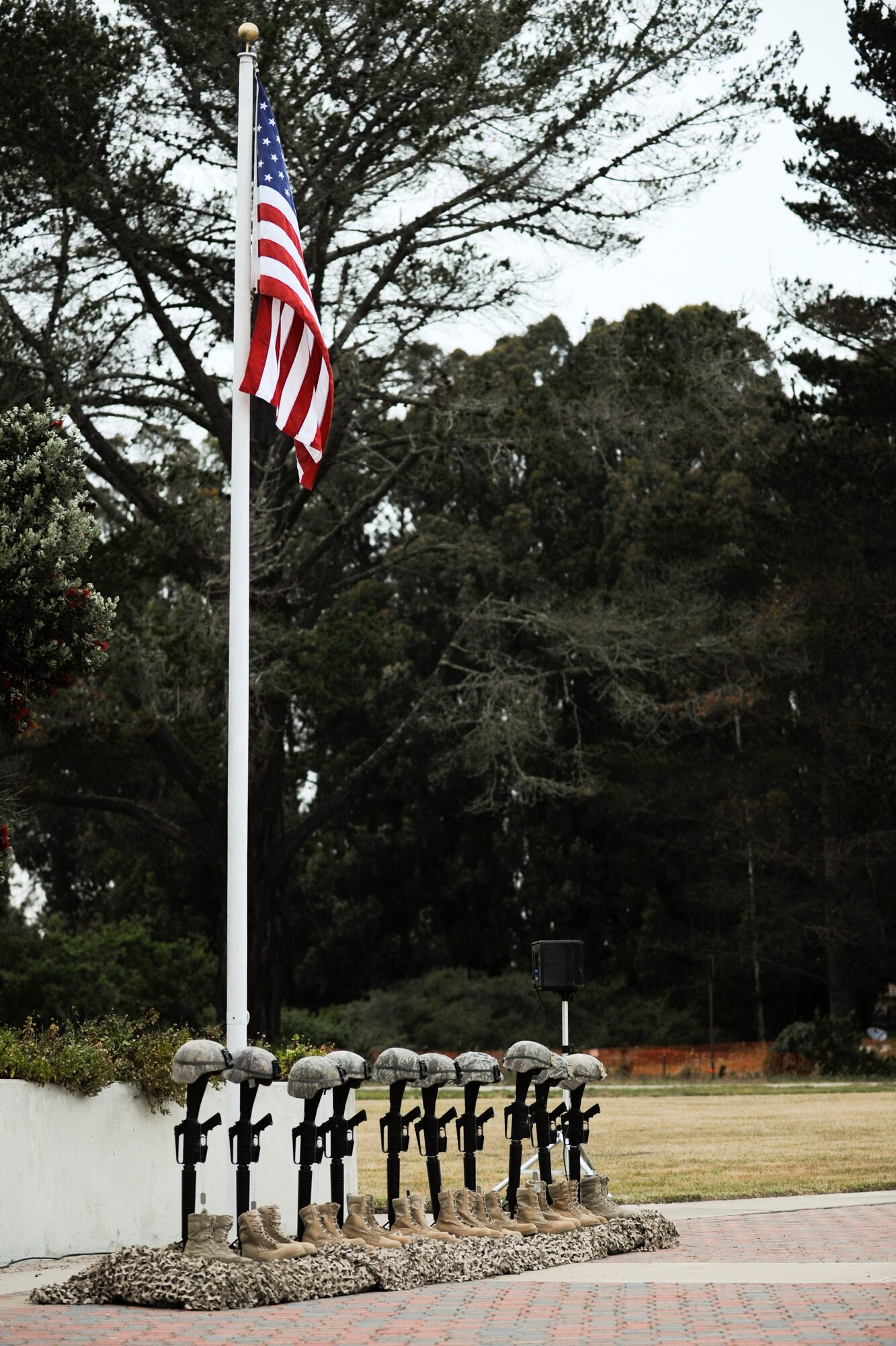 VANDENBERG AIR FORCE BASE, Calif. – Boots are lined up under a flag during the Candlelight Vigil Ceremony at Missile V here Thursday, May 16, 2013. The ceremony was held as part of Vandenberg’s National Police Week commemoration to honor law enforcement personnel who have fallen in the line of duty. (U.S. Air Force photo/Airman Yvonne Morales)