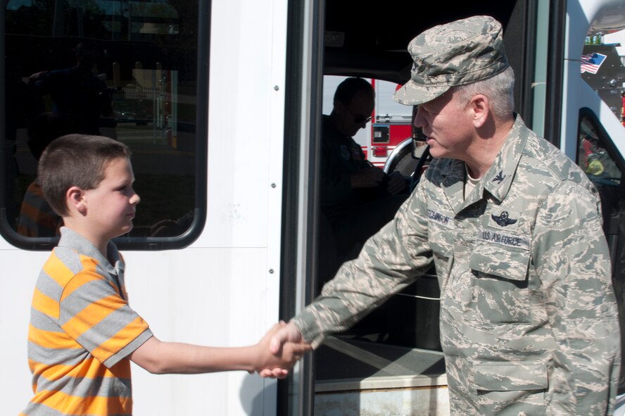 Col. Paul Hutchinson welcomes Caleb Bertrand to Pease Air National Guard Base, N.H., May 17, 2013.  Caleb is part of the Make-A-Wish foundation and is currently undergoing treatment for leukemia. The visit is sponsored by the Pease Kids Corps foundation. (U.S. Air Natonal Guard photo by Tech. Sgt. Aaron Vezeau/Released)