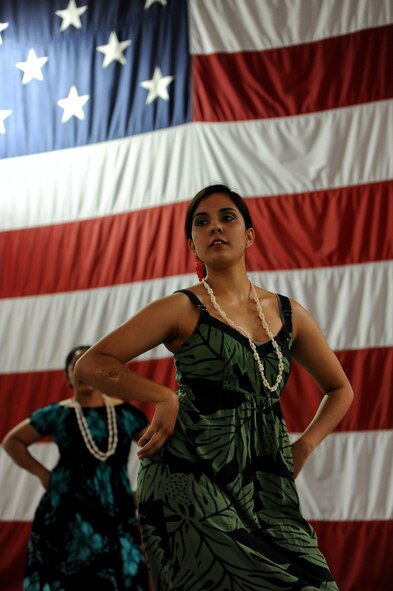 Jessica Kahai, wife of Jairek Kahai, a member of the 509th Aircraft Maintenance Squadron, performs a Hawaiian dance as part of an Asian American and Pacific Islander heritage celebration at Whiteman Air Force Base, Mo., May 8, 2013.  The objective of the celebration was to help educate members of Team Whiteman on the rich cultural tradition Asian Americans and Pacific Islanders provide to American society. (U.S. Air Force photo by Staff Sgt. Nick Wilson/Released)