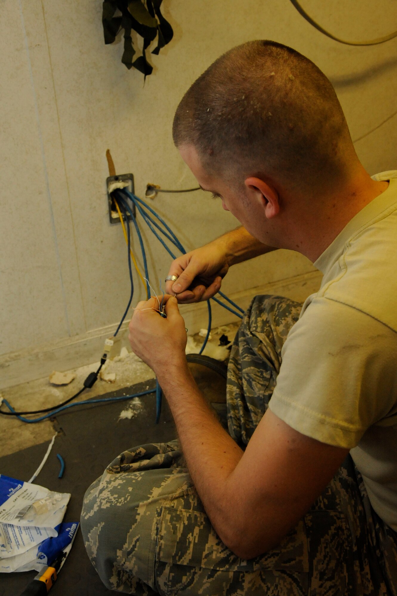 Senior Airman Michael Maner, 2nd Communications Squadron, splits wires on Barksdale Air Force Base, La., May 16, 2013. Communications Airmen's duties include establishing lines of communication for Barksdale and maintaining internet and phone lines. (U.S. Air Force photo/Airman 1st Class Andrew Moua)