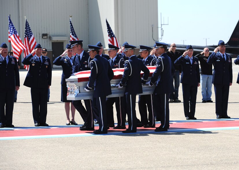 Beale Air Force Base’s Honor Guard carries the remains of U.S. Air Force Staff Sgt. Richard Dickson, of Rancho Cordova, Calif., during a dignified transfer at Beale Air Force Base, Calif., May 10, 2013. Dickson was assigned to the 306th Intelligence Squadron at Beale. (U.S. Air Force photo by John Schwab/Released) 
