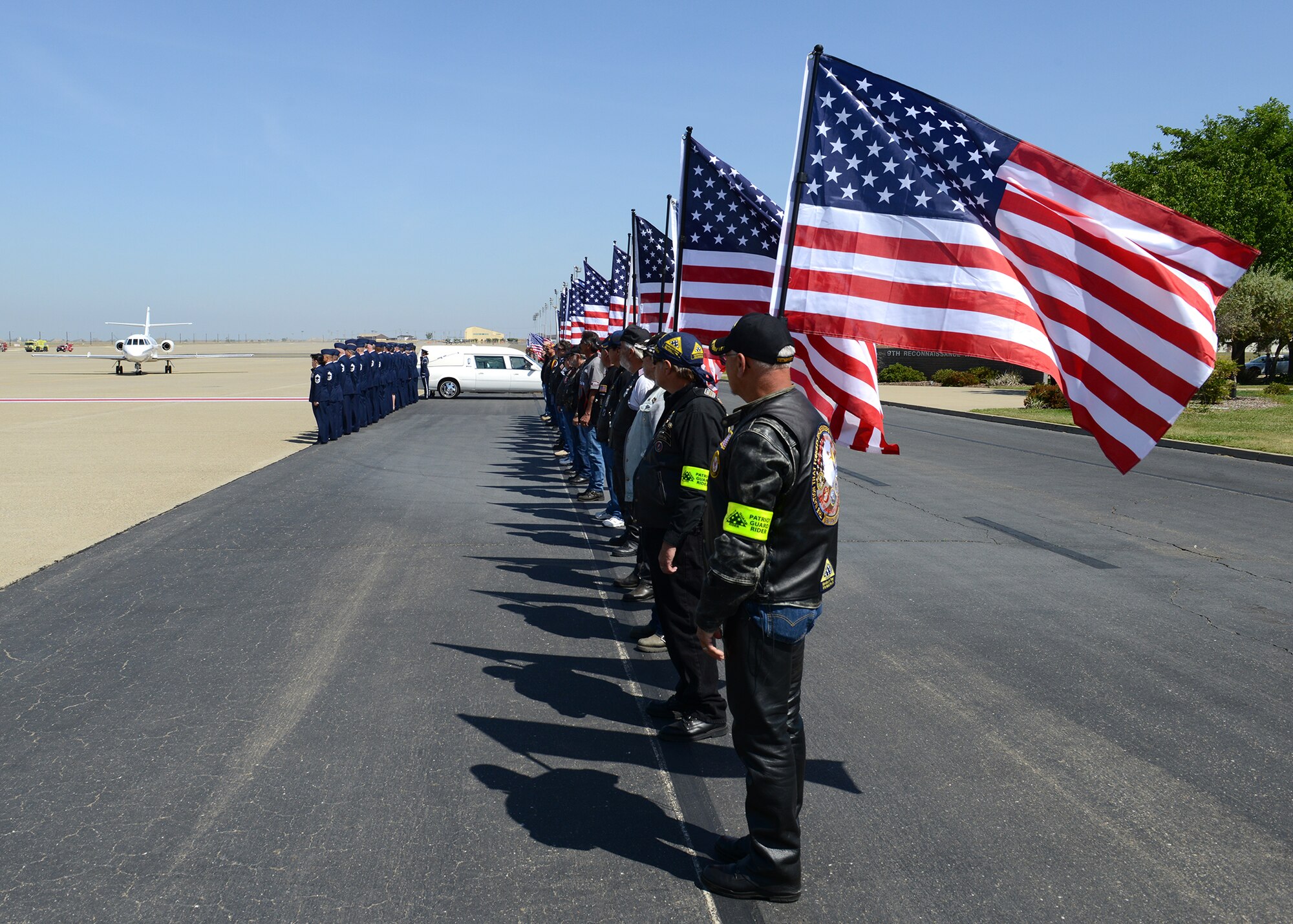 Members of the Patriot Guard Riders honor a fallen Airman during a dignified transfer at Beale Air Force Base, Calif., May 10, 2013. Staff Sgt. Richard Dickson was killed in a MC-12 Liberty aircraft crash in Afghanistan, April 27. (U.S. Air Force photo by John Schwab/Released)