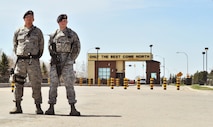 MINOT AIR FORCE BASE, N.D. -- Senior Airman Bryan Bartruff and Airman 1st Class Domingo Perez Jr., 5th Security Forces Squadron response force team members, pose for a photo here, May 13. The primary mission of the 5th SFS is to provide 24-hour law enforcement and security services for the 5th Bomb Wing and all tenant units assigned to the base. (U.S. Air Force photos/Senior Airman Brittany Y. Auld)