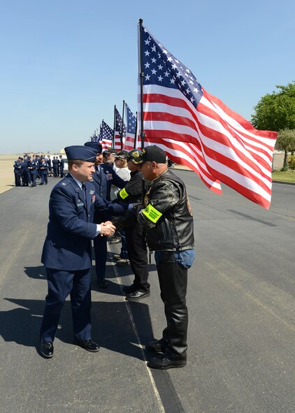 U.S. Air Force Col. Phil Stewart, 9th Reconnaissance Wing commander, shakes hands with members of the Patriot Guard Riders at Beale Air Force Base, Calif., May 10, 2013. The Patriot Guard Riders were present for the dignified transfer of Staff Sgt. Richard Dickson. (U.S. Air Force photo by John Schwab/Released) 
