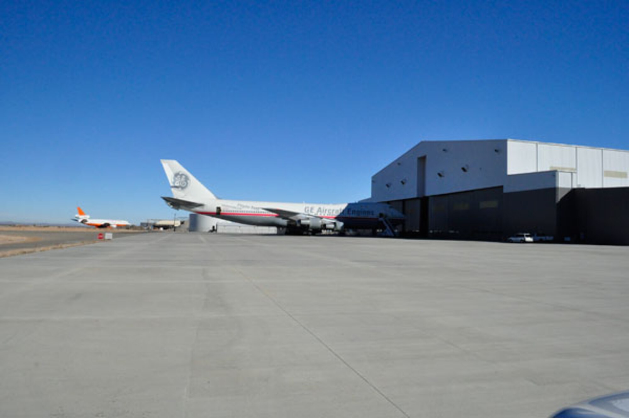 U.S. Air Force property declared surplus under Base Realignment and Closure is now in productive reuse at the former George AFB where General Electric Aviation opened shop to test aircraft engines on planes like this 747-400.