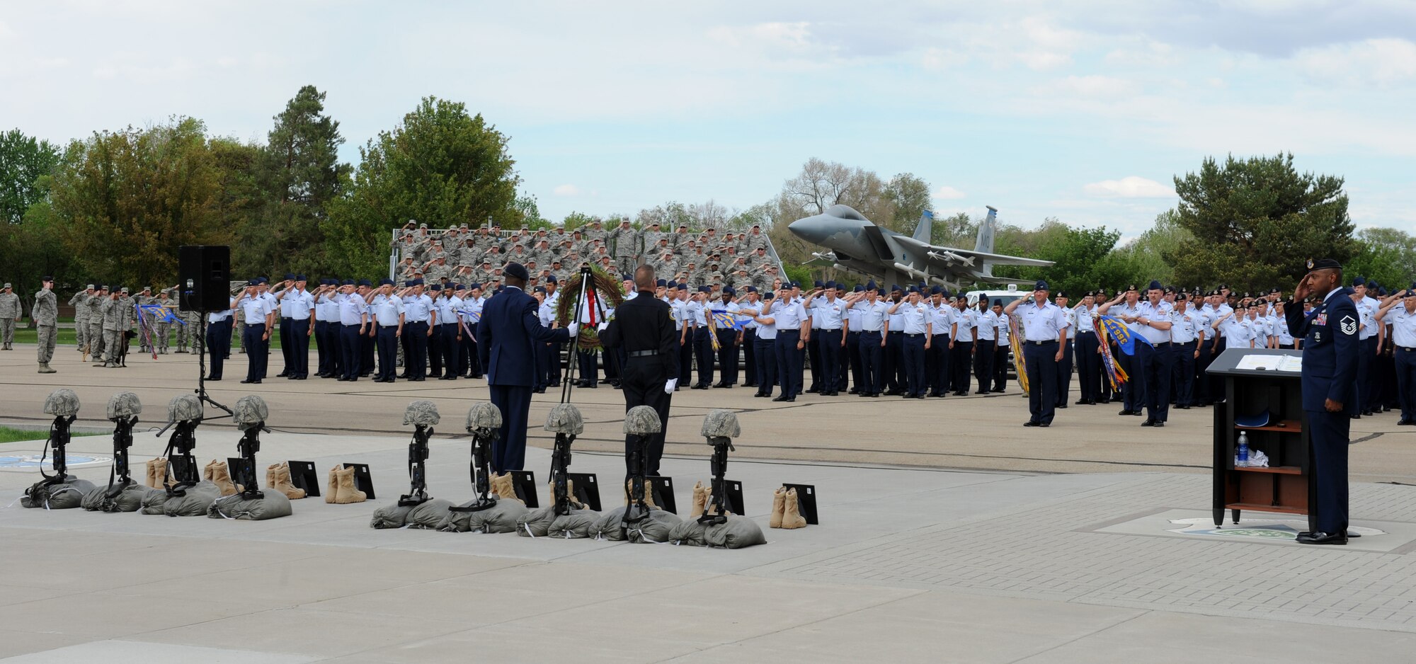 Members from the 366th Fighter Wing salute the flag as the twenty-one gun salute was performed, May 15, 2013, at Mountain Home Air Force Base, Idaho. The twenty-one gun salute was held during the retreat ceremony, as part of Police Week. (U.S. Air Force photo by Airman 1st Class Brittany A. Chase/Released)