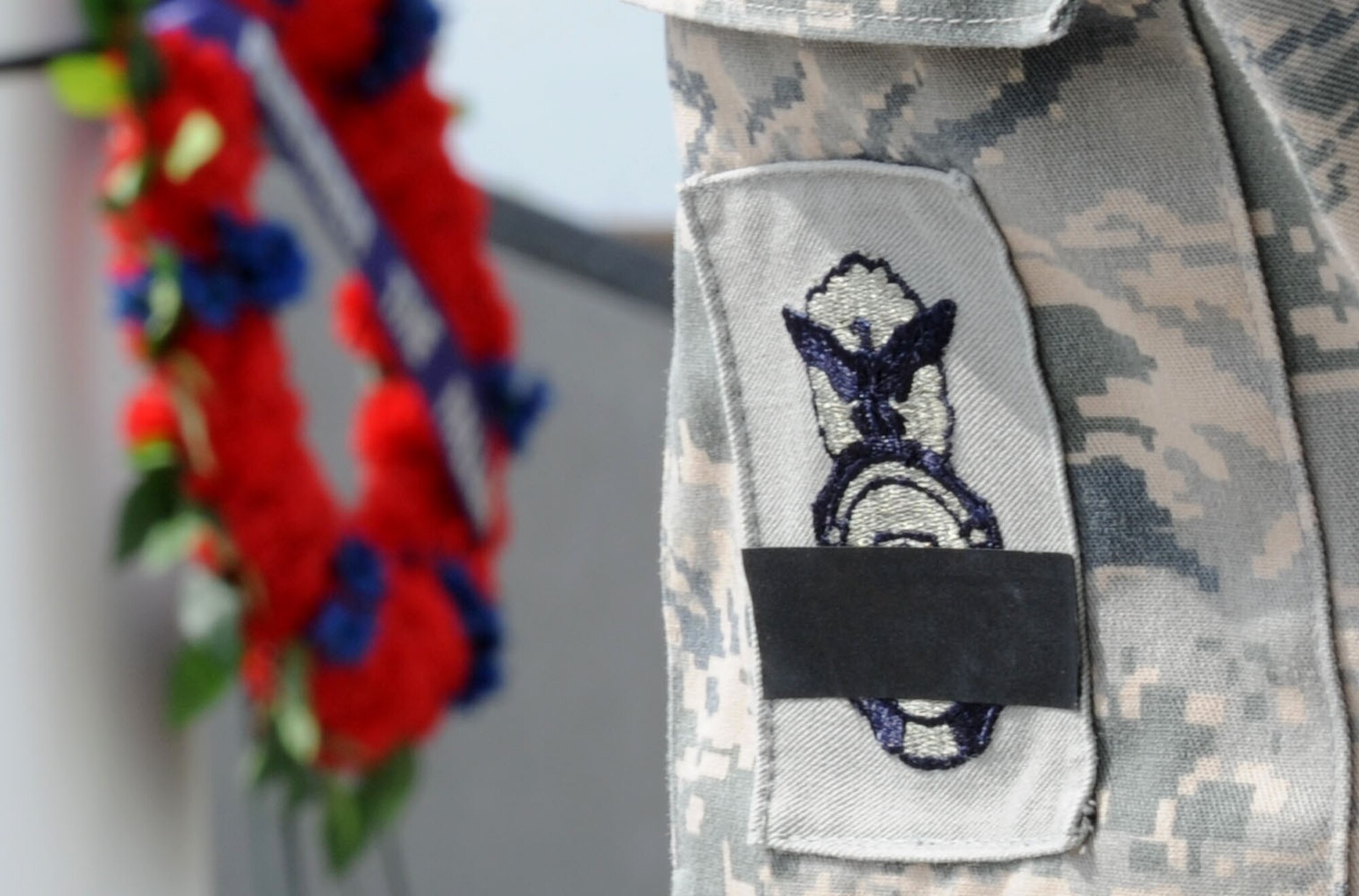 ALTUS AIR FORCE BASE, Okla. – Airmen assigned to the 97th Security Forces Squadron performed 30-minute shifts of the “Guarding of the Wreath” at Wings of Freedom Park, May 15. In observance of National Police Week and in honor of Peace Officers Memorial Day, which is held annually to recognize law enforces killed or disabled in the line of duty, 97th SFS members covered their badge with black tape to honor fallen defenders. (U.S. Air Force photo by Airman 1st Class Klynne Pearl Serrano / Released)