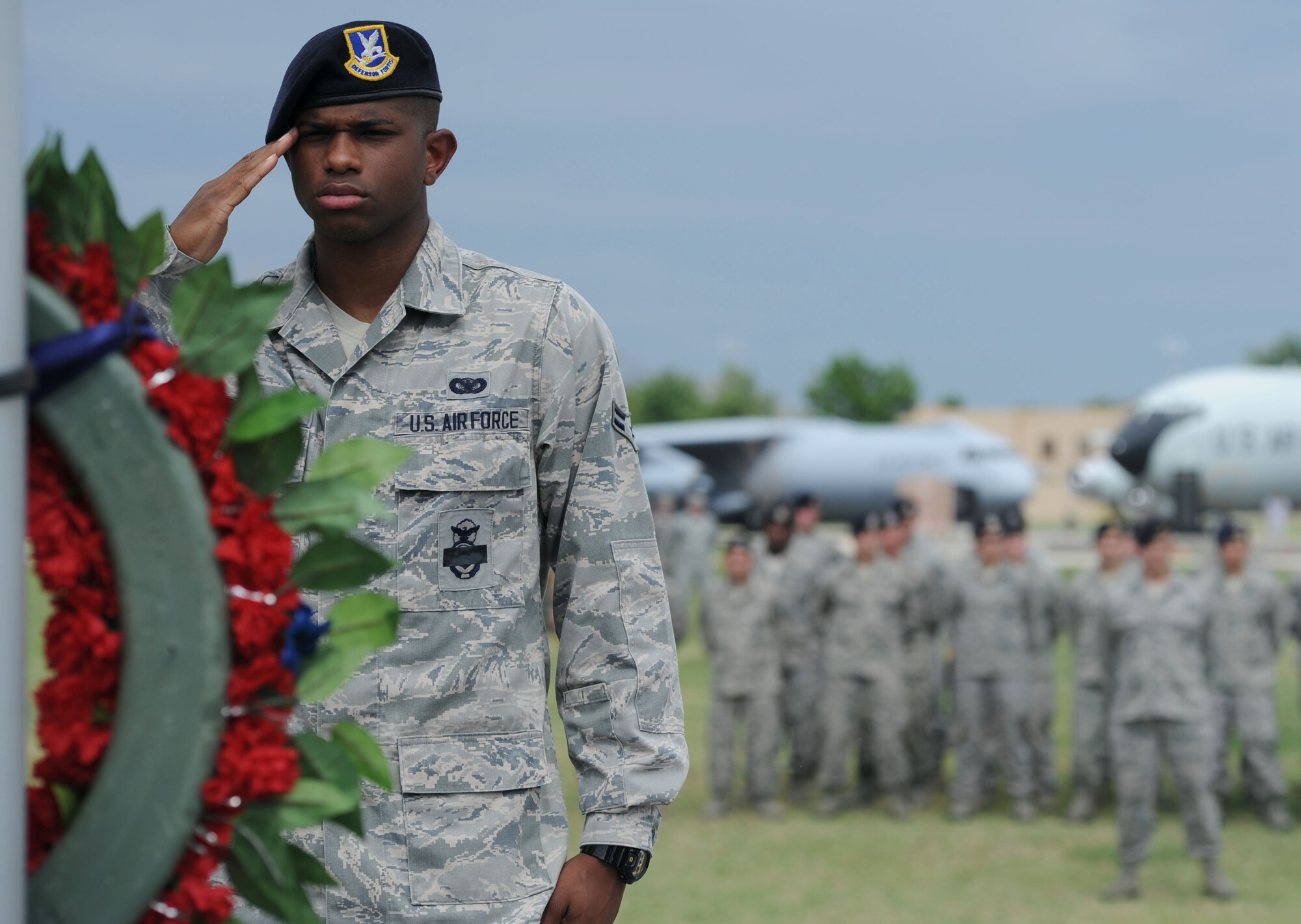 ALTUS AIR FORCE BASE, Okla. – Airman 1st Class Jaylon Roberts, 97th Security Forces Squadron patrolman, renders a salute while guarding the wreath at Wings of Freedom Park, May 15. Members of the 97th SFS performed 30-minute shifts of “Guarding of the Wreath” in honor of law enforcement officers killed or disabled in the line of duty. Before retiring the wreath the 97th SFS performed a 21-gun salute and played Taps in remembrance of the fallen defenders.  (U.S. Air Force photo by Airman 1st Class Klynne Pearl Serrano / Released)