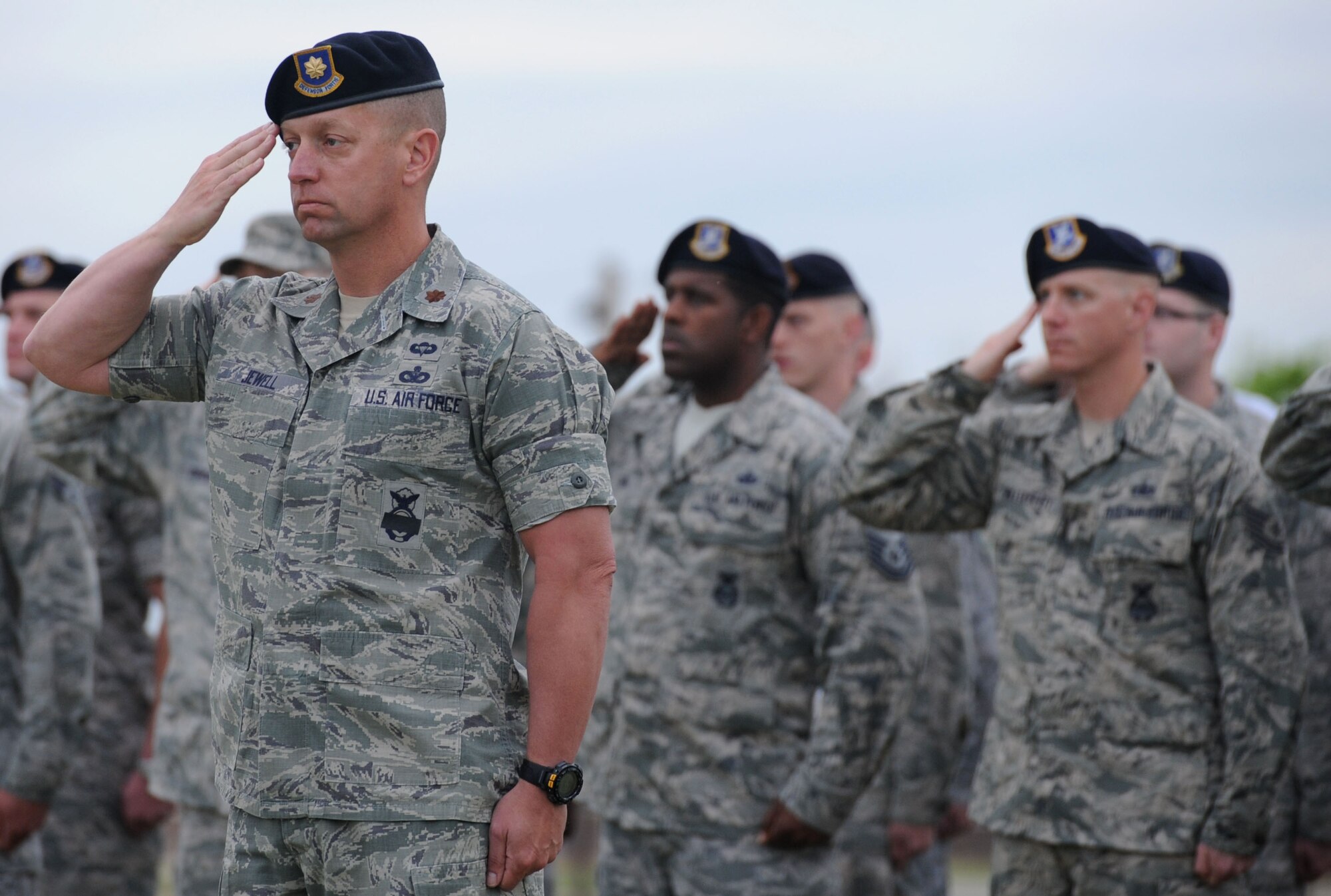 ALTUS AIR FORCE BASE, Okla. – Members of the 97th Security Forces Squadron render a salute during reveille at Wings of Freedom Park, May 15. In observance of National Police Week, the 97th SFS performed the “Guarding of the Wreath” shortly after reveille. (U.S. Air Force photo by Airman 1st Class Klynne Pearl Serrano / Released)