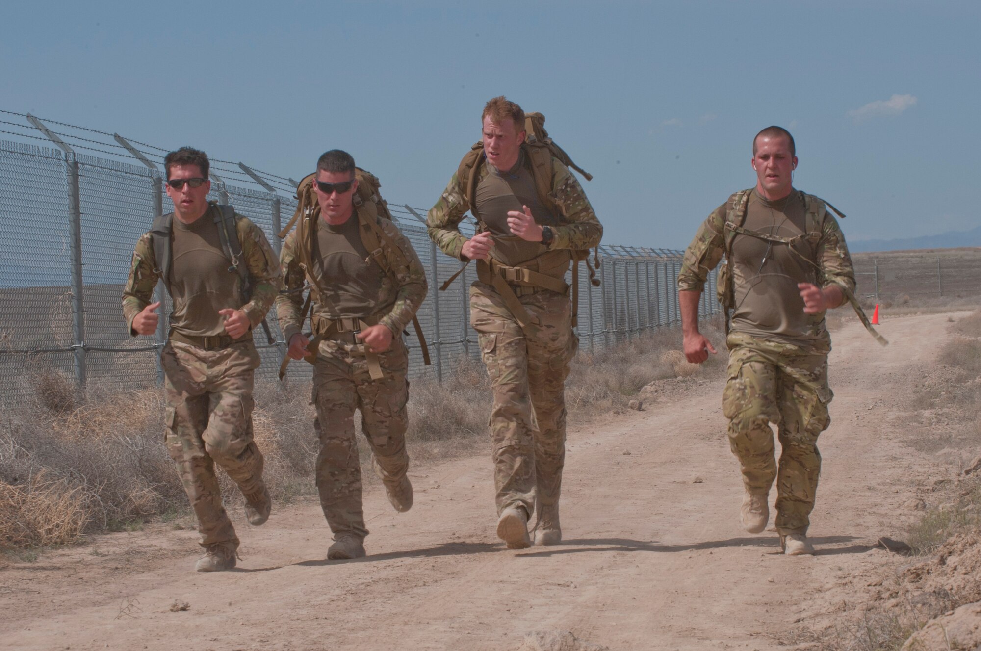 Members from the 366th Fighter Wing perform a six mile ruck march during Police Week at Mountain Home Air Force Base, Idaho, May 13, 2013. Police Week recognizes the bravery and sacrifices that state, local and military police officers make and consist of multiple events such as capabilities demonstrations and a retreat ceremony. (U.S. Air Force photo by Staff Sgt. Roy Lynch/Released)