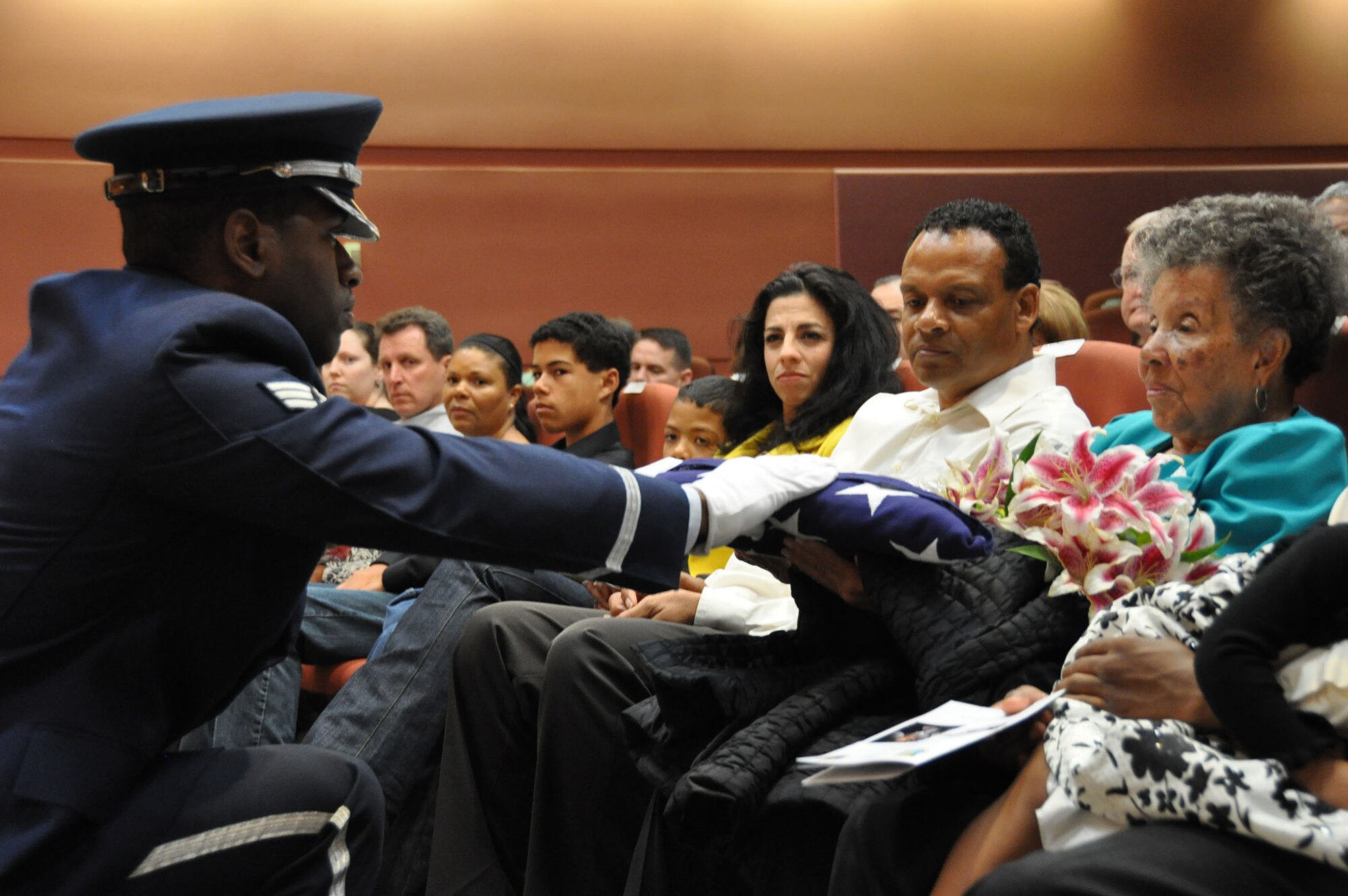 TRAVIS AIR FORCE BASE, Calif. -- After more than 33 years of faithful service to her country, Chief Master Sgt. Denise P. Butler, Superintendent, 349th Aerospace Medicine Squadron, celebrates her many years of service during a ceremony held in her honor at Travis Air Force Base, Calif. on April 7, 2013. (U.S. Air Force photo / Senior Airman Amelia Leonard) 