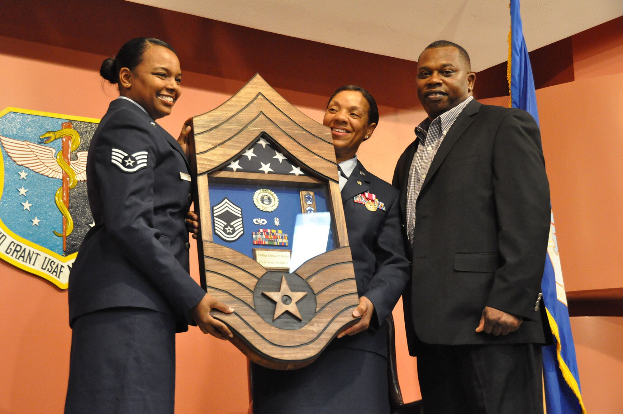 TRAVIS AIR FORCE BASE, Calif. -- After more than 33 years of faithful service to her country, Chief Master Sgt. Denise P. Butler, Superintendent, 349th Aerospace Medicine Squadron, celebrates her many years of service during a ceremony held in her honor at Travis Air Force Base, Calif. on April 7, 2013. (U.S. Air Force photo / Senior Airman Amelia Leonard) 