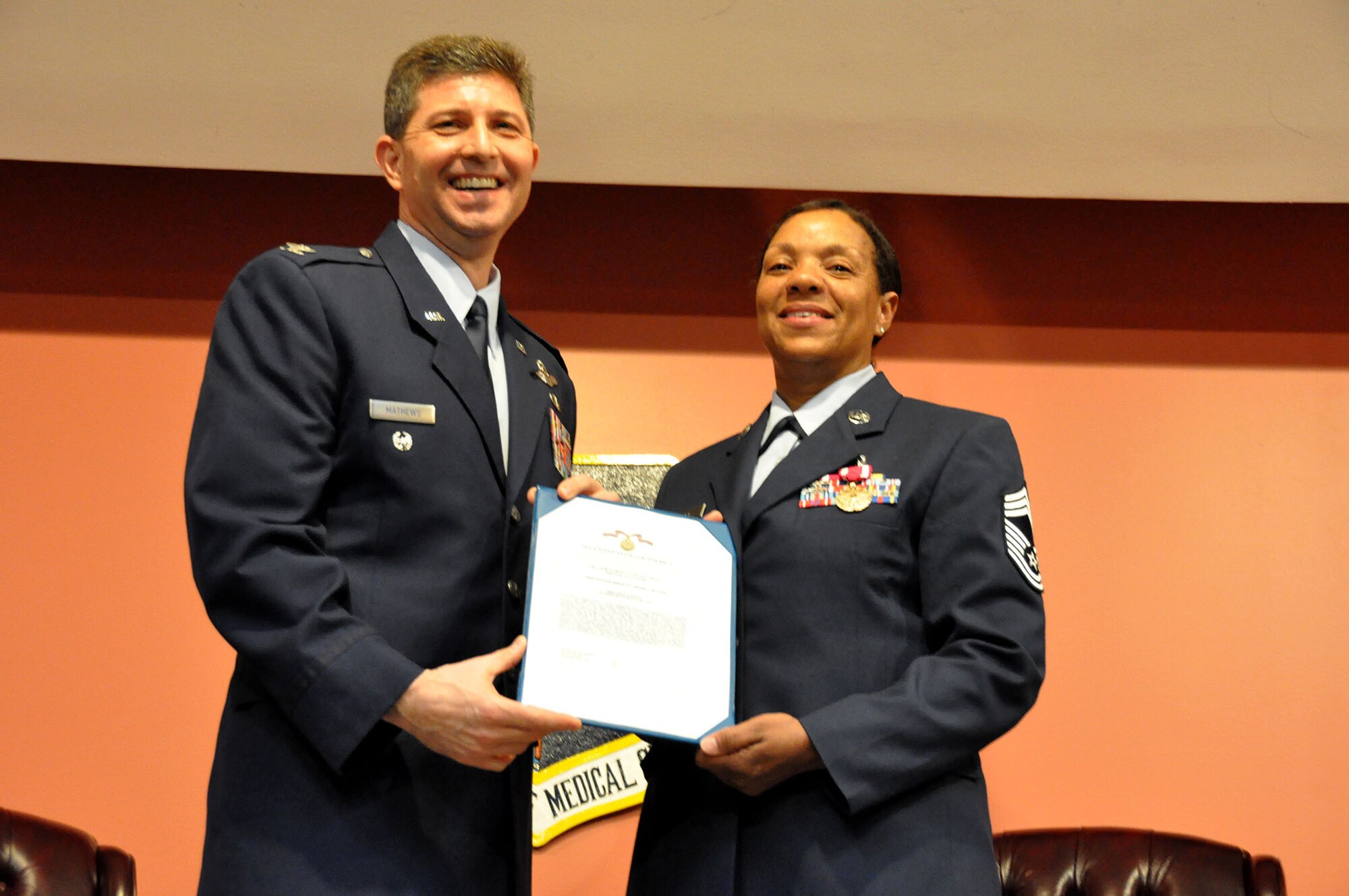 TRAVIS AIR FORCE BASE, Calif. -- After more than 33 years of faithful service to her country, Chief Master Sgt. Denise P. Butler, Superintendent, 349th Aerospace Medicine Squadron, celebrates her many years of service during a ceremony held in her honor at Travis Air Force Base, Calif. on April 7, 2013. (U.S. Air Force photo / Senior Airman Amelia Leonard) 