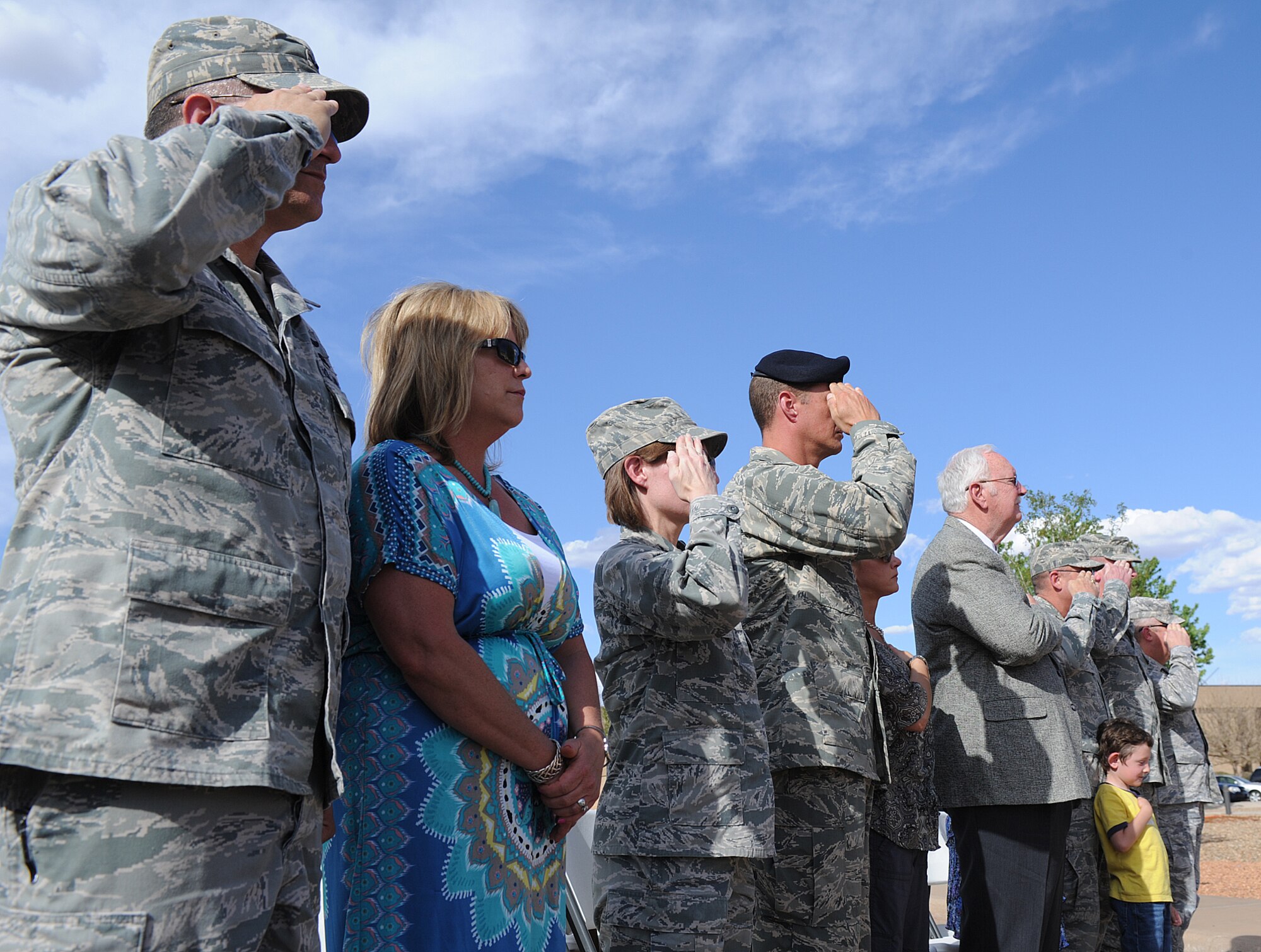 U.S. Air Force service members salute during a retreat ceremony held in honor of National Police Week at Cannon Air Force Base, N.M., May 15, 2013. National Police Week is an observance held to honor law enforcement officials for their sacrifices and hard work. (U.S. Air Force photo/Senior Airman Ericka Engblom)