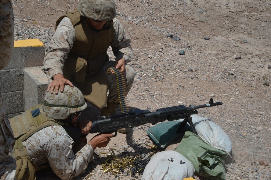 U.S. Marines from the Bulk Fuel Company C, 6th Engineer Support Battalion, 4th Marine Logistics Group, fire an M240B May 4. The Marines were getting refresher training on crew-served weapons systems. (U.S. Air Force photo/Airman 1st Class James Hensley)