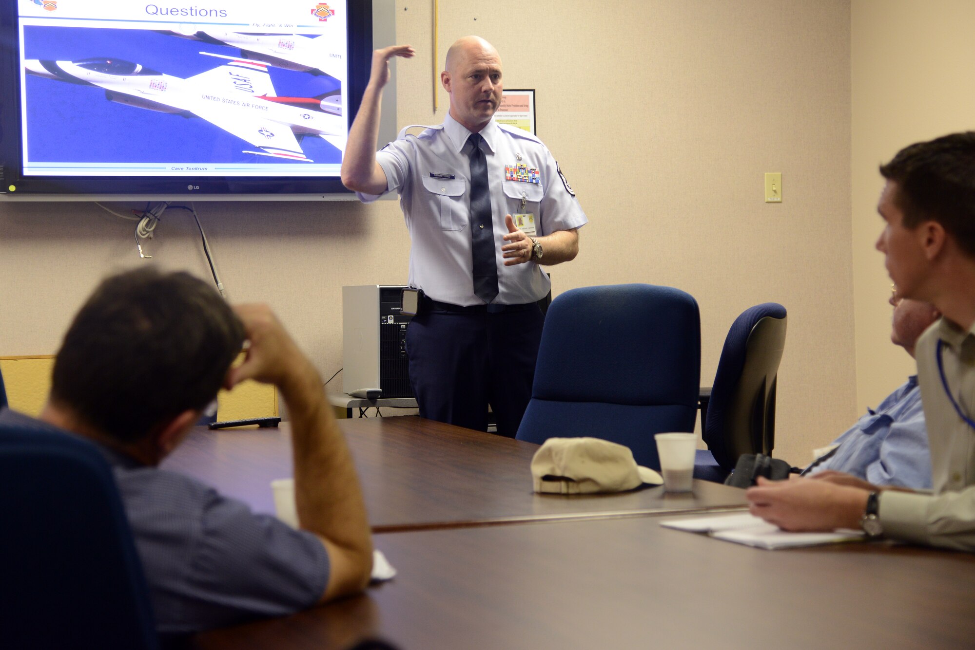 Master Sgt. Michael Crawford, 56th Aerospace Medicine Squadron flight chief of fight medicine, gives out information to the attendees during the foreign student medical tour at Luke Air Force Base, May. 2. Aviation and occupational medicine students from the University of Otago, New Zealand, traveled to Phoenix to get a glimpse of the mission here at Luke. (U.S. Air Force photo/Airman 1st Class Devante Williams)