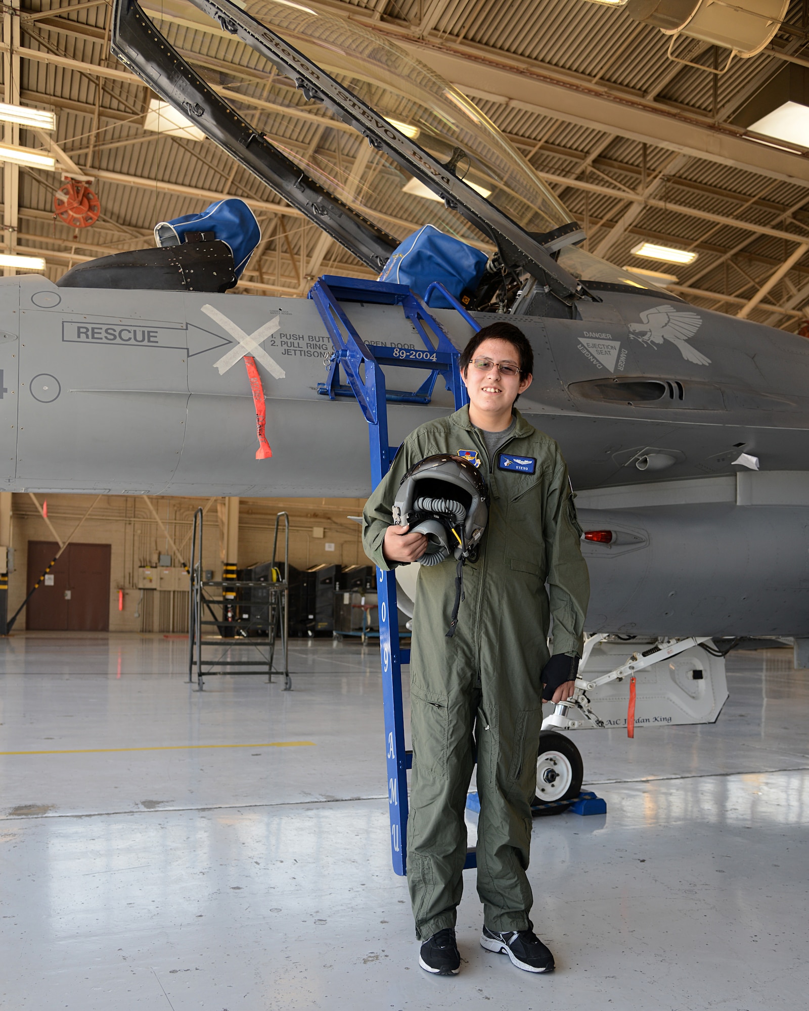 Steven Boyd, 15, pilot for a day, poses for a hero shot at Luke Air Force Base May 10. The pilot for a day program focuses on children who have serious or chronic conditions. Luke’s pilot for a day program invites children of all ages to be a part of a flying squadron for an entire day. (U.S. Air Force photo/Airman 1st Class Devante Williams)