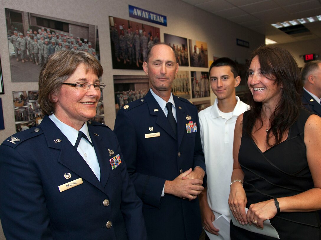TRAVIS AIR FORCE BASE, Calif. -- Maj. Alan M Tornay accepts takes over command of the 45th Aerial Port Squadron during a change of command ceremony at May 4, 2013 at Travis Air Force Base, Calif.  (U.S. Air Force photo / Lt. Col. Robert Couse-Baker)