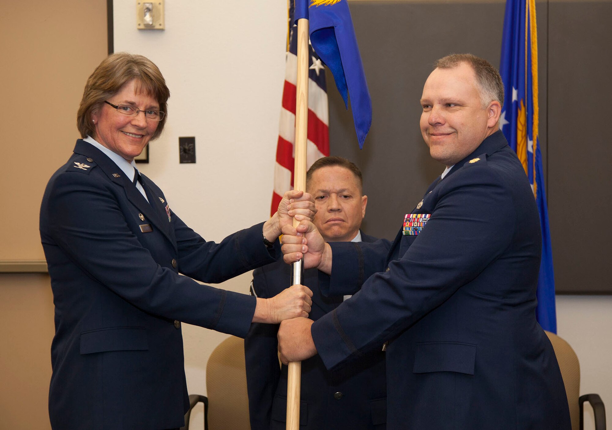 TRAVIS AIR FORCE BASE, Calif. -- Maj. Alan M Tornay accepts takes over command of the 45th Aerial Port Squadron during a change of command ceremony at May 4, 2013 at Travis Air Force Base, Calif.  (U.S. Air Force photo / Lt. Col. Robert Couse-Baker)