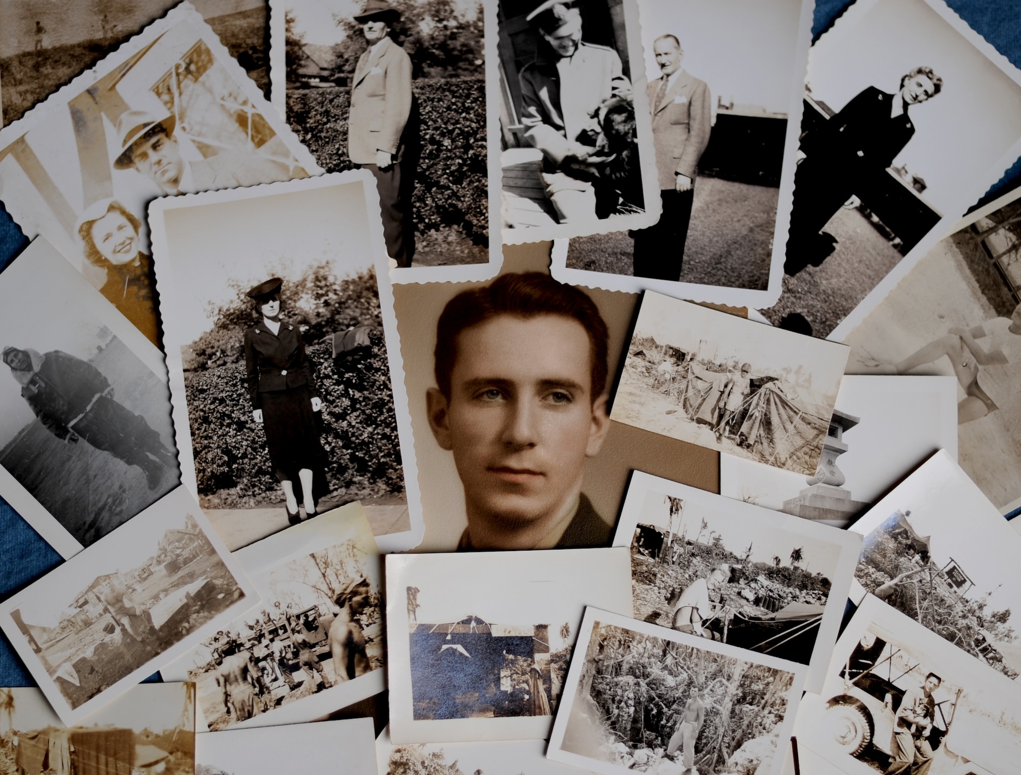Photos of 2nd Lt. Robert Shaw, along with a collection of photos of his family and the island where he passed away, are made into a collage. Shaw, a U.S. Army Air Forces weatherman, died in World War II after sacrificing his life to protect his fellow soldiers. (Photo by Air Force Airman Areca T. Wilson/ Released)