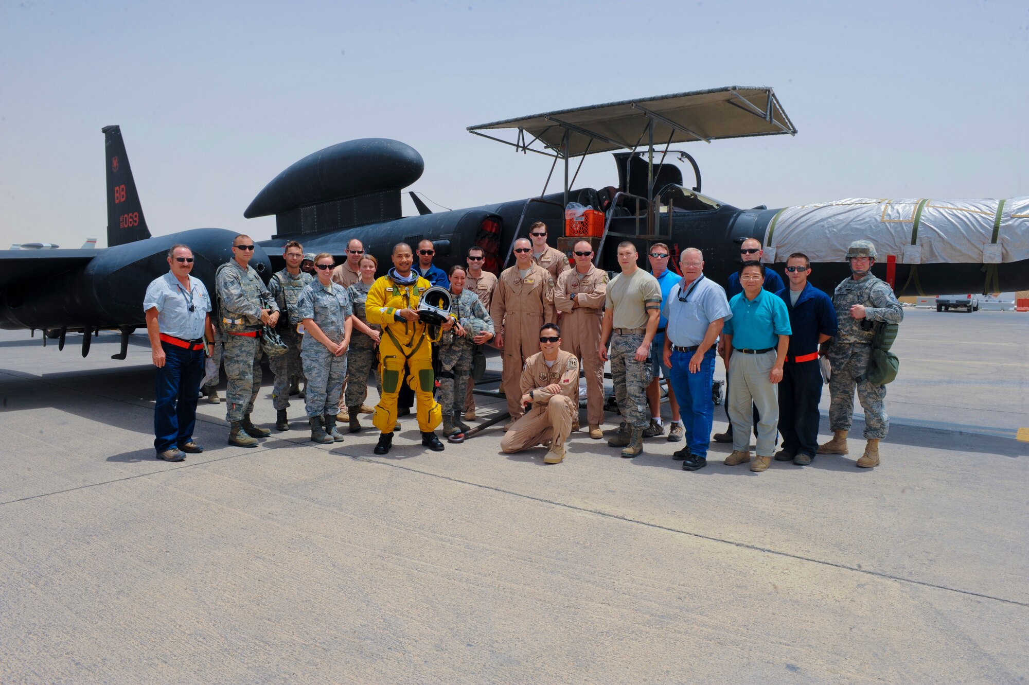 U.S. Air Force Maj. Patrick Hudson (center), 99th Expeditionary Reconnaissance Squadron U-2 pilot, takes a group photo with fellow members of the 99th ERS. During the flight, Hudson reached a milestone of 2,000 U-2 hours Hudson hails from Fayette, Miss., and is deployed from Beale Air Force Base, Calif. (U.S. Air Force photo by Staff Sgt. Joshua J. Garcia)