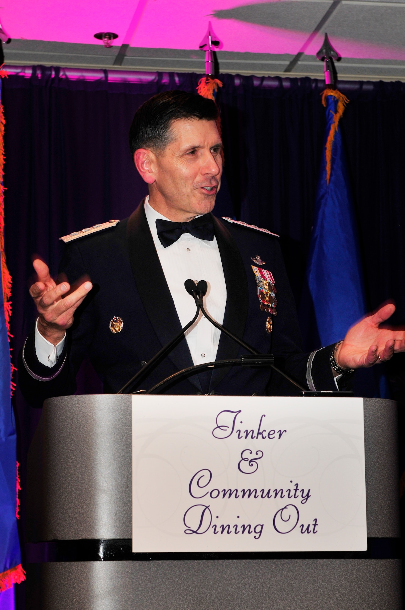Lt. Gen. C.D. Moore II, commander of the Air Force Life Cycle Management Center at Wright-Patterson Air Force Base, delivers his keynote address to a packed crowd during the Tinker & Community Dining Out May 3 at the Tinker Club. General Moore praised the work taking place at Tinker and for keeping him safe while he flew fighters for more than 20 years.   (Air Force photo by Darren D. Heusel)