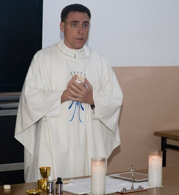Chaplain Maj. Robert Monagle, 39th Air Base Wing chaplain, begins a Catholic service for U.S. Army soldiers April 14, 2013 at Gaziantep, Turkey. The soldiers are members of the 3rd Battalion, 2nd Air Defense Artillery deployed from Fort Sill, Okla., in support of the NATO patriot battery mission. (U.S. Air Force photo by Staff Sgt. Eric Summers Jr./Released.)