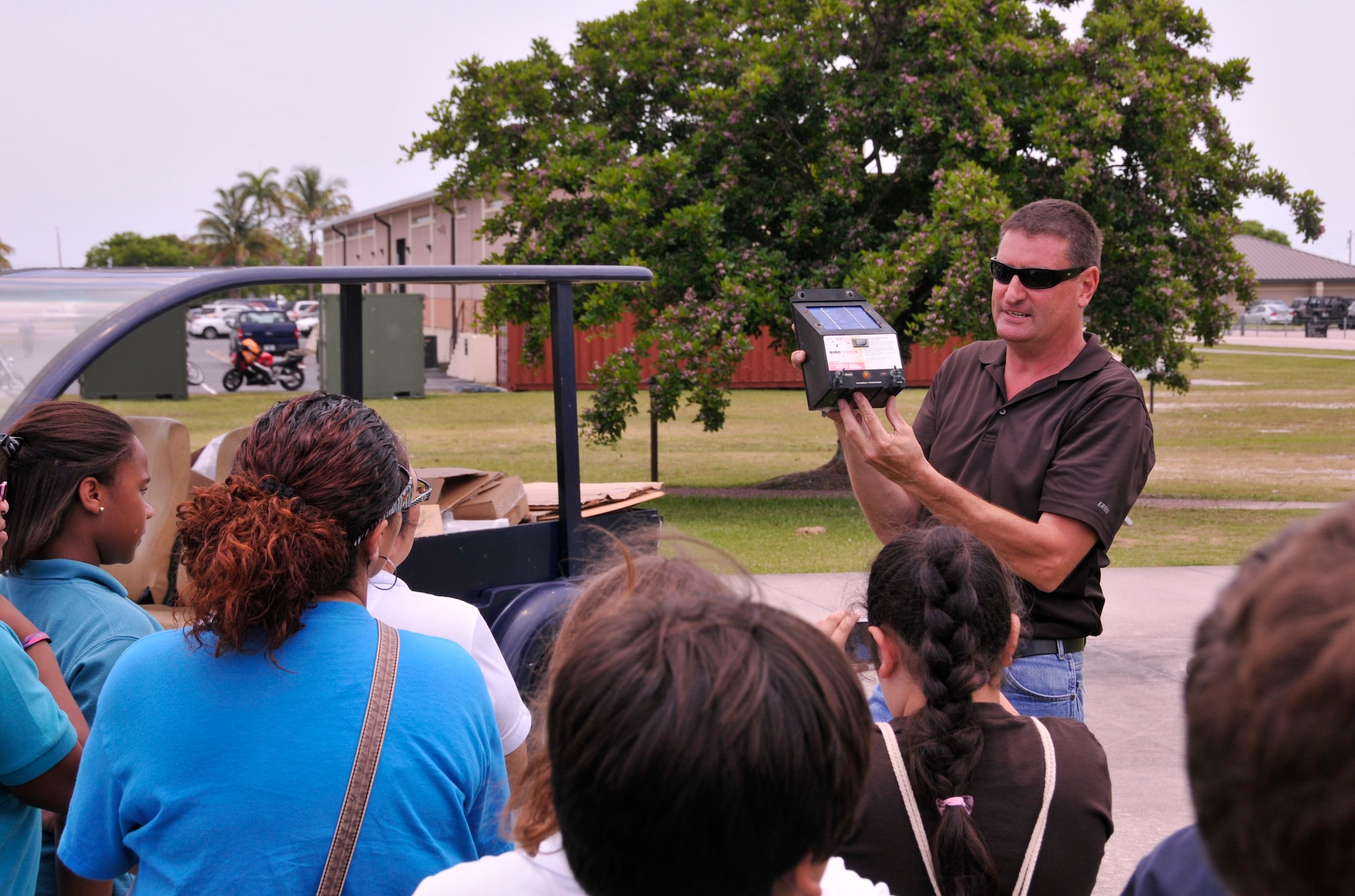 Mr. Tim Driscoll, Homestead Air Reserve Base environmental protection specialist, demonstrates how the base utilizes solar power to students from Homestead, Fla.’s Air Base Elementary Green Team during an environmental tour at Homestead Air Reserve Base, Fla., May 13. The environmental tour was conducted as an educational experience for the Green Team in conjunction with Earth Day. The team includes more than 25 children, from grades three through five, who are part of the environmentally focused school club. (U.S. Air Force photo/Senior Airman Nicholas Caceres)