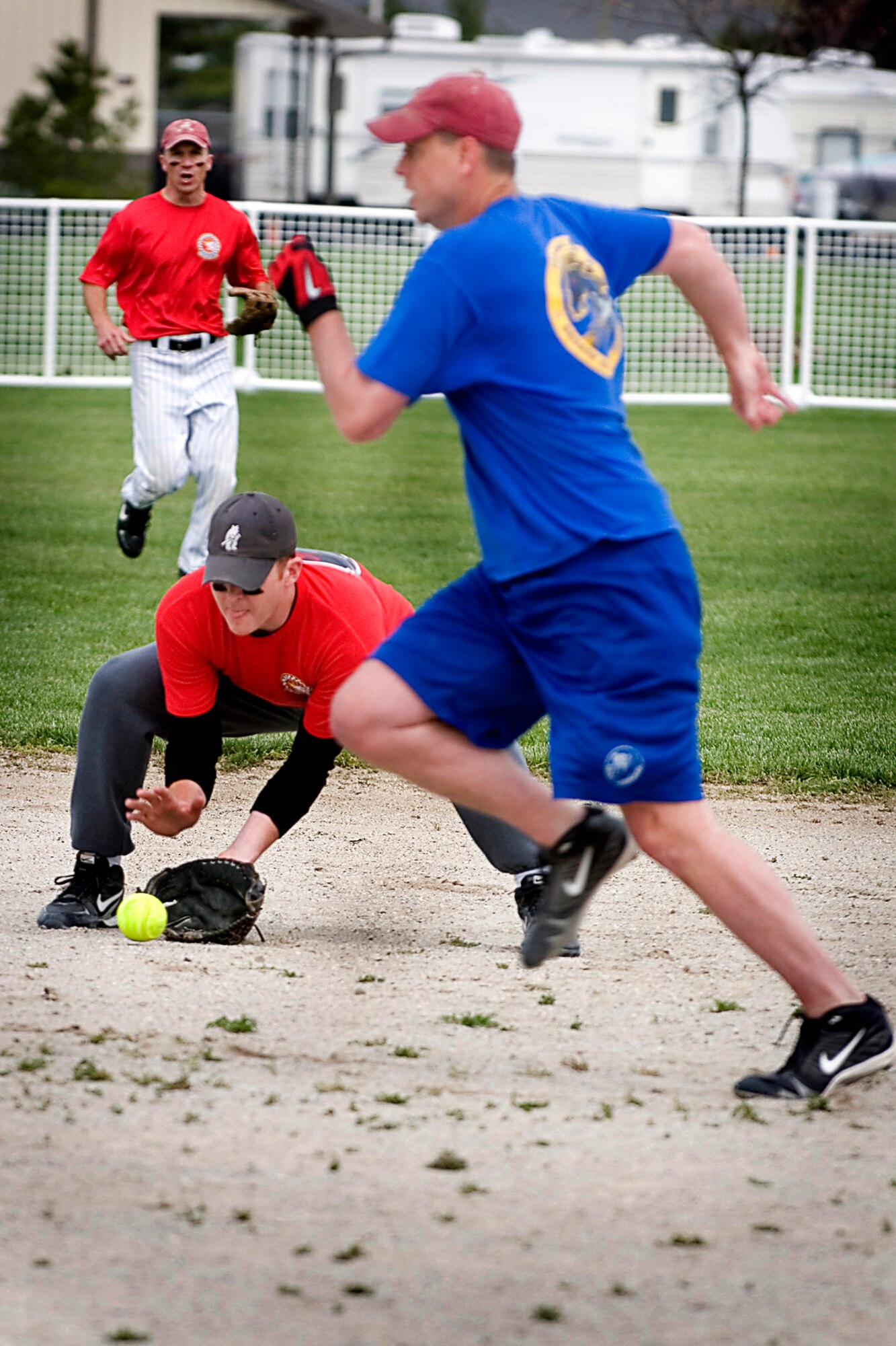 GRISSOM AIR RESERVE BASE, Ind. -- Joel Nickelson, 74th Air Refueling Squadron short stop, concentrates on the ball as Chad Tice, 72nd Air Refueling Squadron third baseman cuts in front of him as he tries to advance on an infield hit. The74th ARS won the 7th Annual Jovanovich Cup by a score of 9-5. (U.S. Air Force photo/Tech. Sgt. Doug Hays)