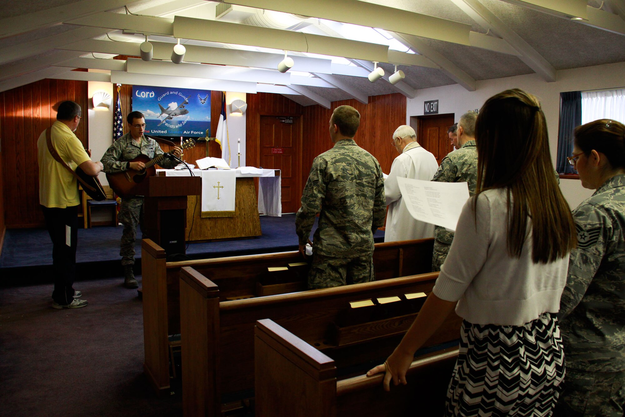 Col. Daryl J. Hartman (ret.) and his nephew, Senior Airmen Benjamin J. Lowry perform worship music during the Protestant Worship Service, held at the Pittsburgh International Airport Air Reserve Station, May 5, 2013. Protestant Service and Catholic Mass are held at the base Chapel during every Unit Training Assembly and is open to all Airmen and their families. (U.S. Air Force photo by Senior Airman Justyne Obeldobel/Released)
