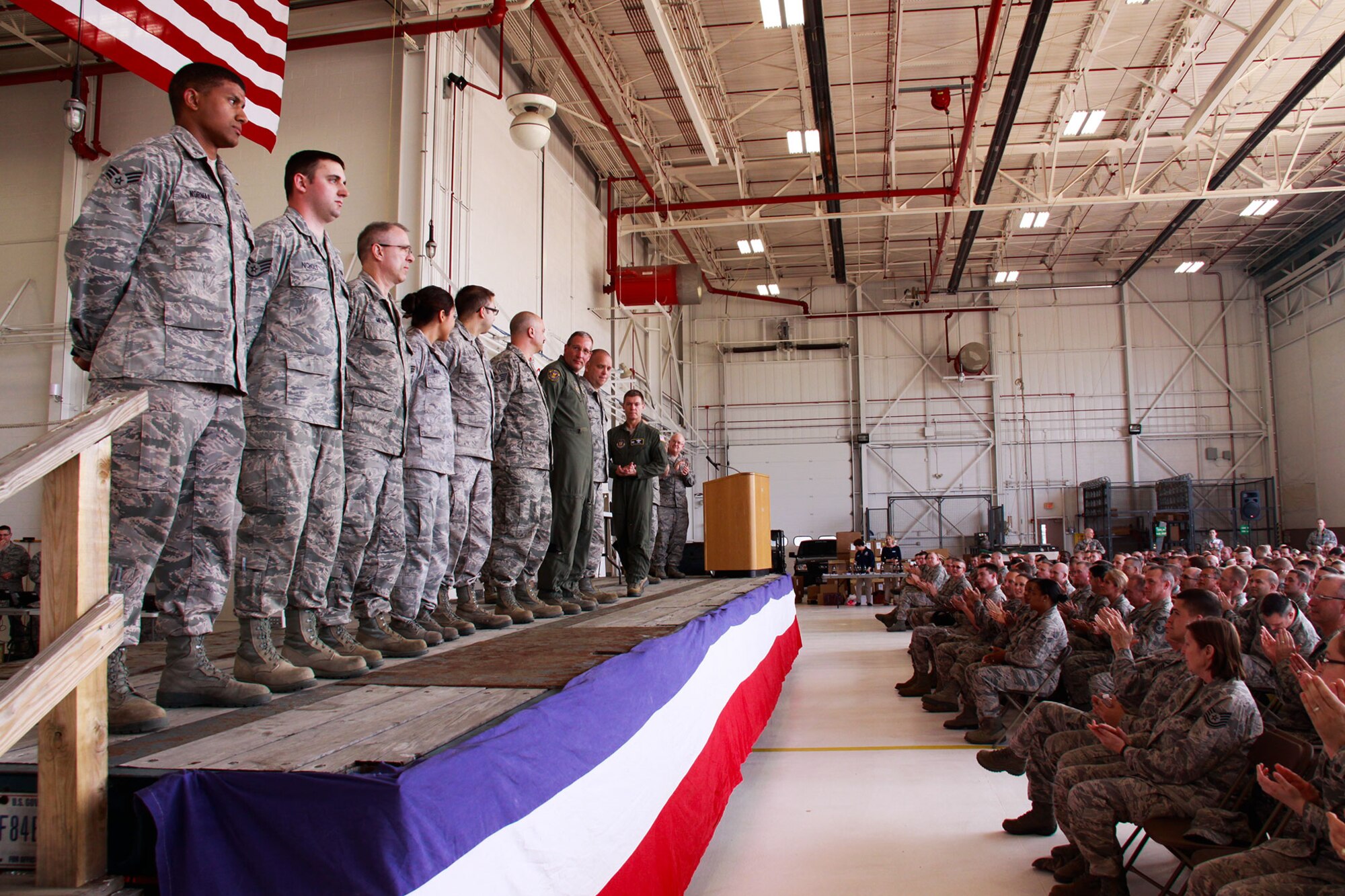 Col. Craig C. Peters, 911th Airlift Wing commander and Command Chief Brian Zator, present and congratulate eight Airlift Wing Airmen for successfully earning their Community College of the Air Force degrees at the Pittsburgh International Airport Air Reserve Station, May 4, 3013.  Following the presentation, Zator spoke about the importance a CCAF degree has on member's career development and promotion.  Beginning Oct. 1, 2013 a CCAF degree will required to earn the rank of senior master sergeant. and above (U.S. Air Force photo by Senior Airman Justyne Obeldobel/Released)