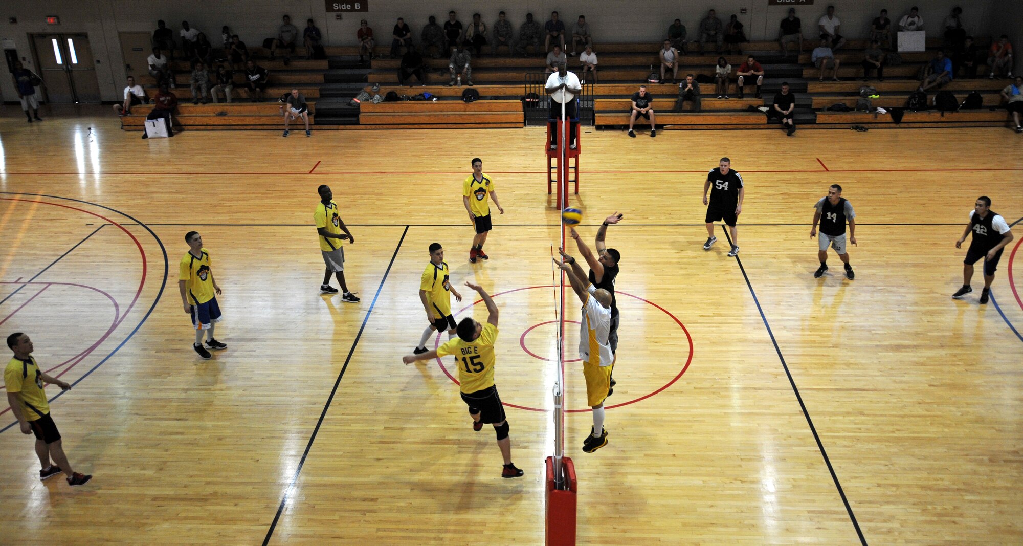 The 51st Maintenance Squadron intramural volleyball team blocks a return hit during the intramural volleyball championship match at Osan Air Base, Republic of Korea, May 15, 2013. The 51st MXS team defeated the 51st Communications Squadron team to capture the championship trophy. (U.S. Air Force photo/Staff Sgt. Emerson Nuñez)