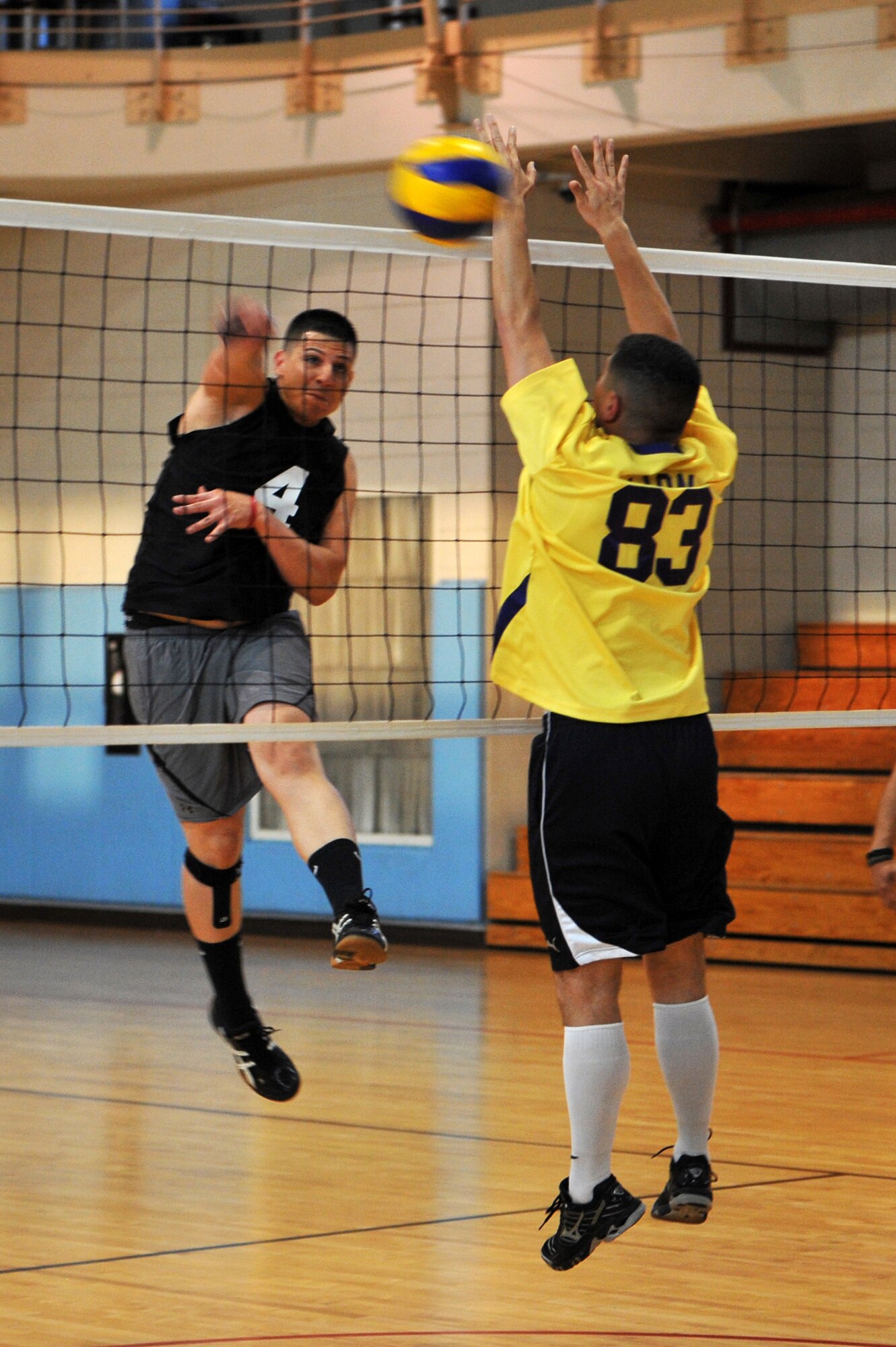 Senior Airman Fermin Rodriguez Santiago, 51st Maintenance Squadron aircraft electrical and environment specialist, spikes the volleyball as Tech. Sgt. Daniel Leon, 51st Communication Squadron network management NCOIC, attempts to block it at Osan Air Base, Republic of Korea, May 15, 2013.  There were 16 teams in the league competing for the coveted 2013 Intramural Volleyball Championship trophy.  (U.S. Air Force photo/Staff Sgt. Emerson Nuñez)