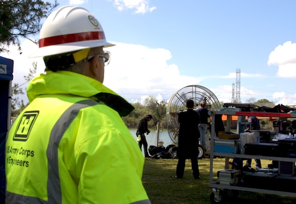 Steve McCombs, an occupational safety and health specialist with the Corps of Engineers' Los Angeles District, looks on as a crew films a scene for the National Guard's new recruiting commercial.  The scene was shot at Whittier Narrows Park, a flood control area managed by the district, March 8.  The district handles numerous permit requests to film at other locations the district manages, including the Los Angeles River.