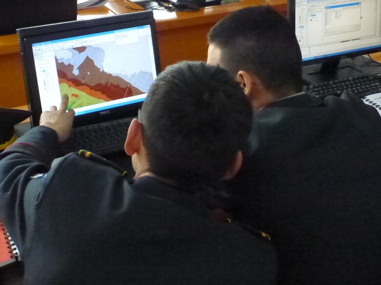 Representatives from the Mongolian Armed Forces explore interpolated raster surfaces at the Advanced GIS Workshop.