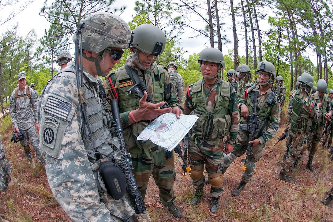 Indian army Maj. Prashant Mishra, center, reviews the route for a training patrol with U.S. Army 1st Lt. Alexander Stodola, left, during Yudh Abhyas 2013 on Fort Bragg, N.C., May 8, 2013. Mishra, a company commander, is assigned to the 99th Mountain Brigade and Stodola, a platoon leader, is assigned to the 82nd Airborne Division’s 1st Brigade Combat Team.