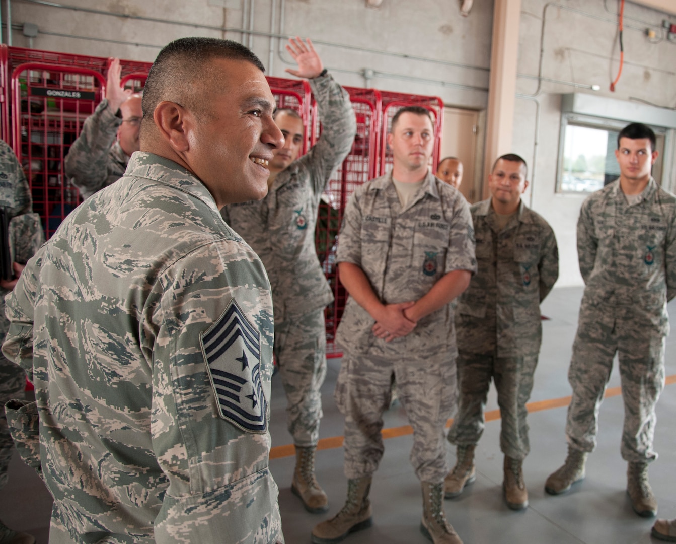 Chief Master Sgt. Gerardo Tapia, Air Education and Training Command command chief, speaks with firefighters from Laughlin’s 47th Civil Engineer Squadron at Laughlin Air Force Base, Texas, May 16, 2013. While visiting Laughlin, Tapia inspected several base facilities and met with numerous airmen from around base. (U.S. Air Force photo/Airman 1st Class John D. Partlow)