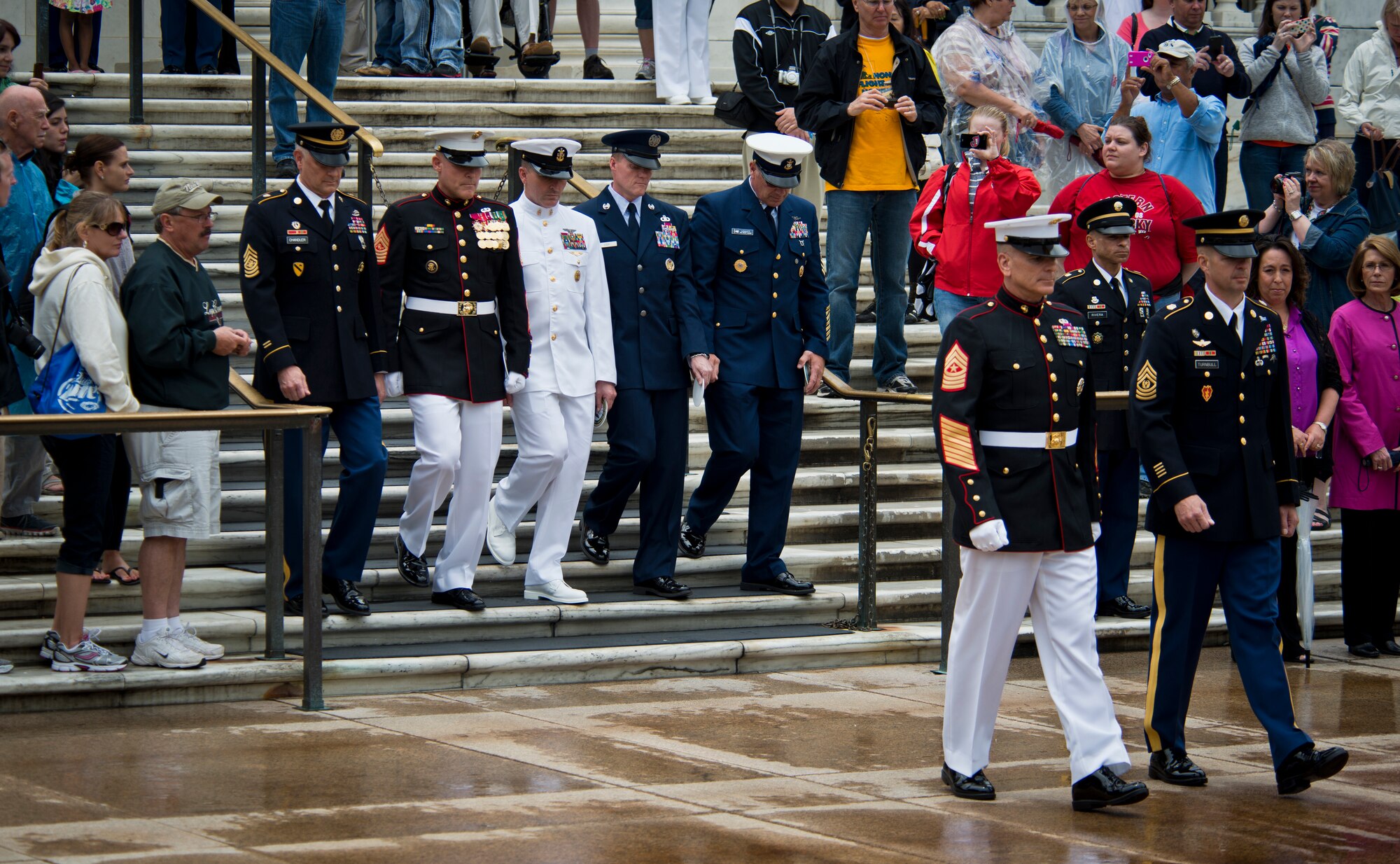 Marine Corps Sgt. Maj. Bryan B. Battaglia and Army Sgt. Maj. David O. Turnbull lead a formation of the senior enlisted leaders from the Army, Navy, Marine Corps, Air Force and Coast Guard during a wreath-laying ceremony May 18, 2013, at the Tomb of the Unknown Solider at Arlington National Cemetery, Va. The ceremony celebrates the unification of all the military forces under a single Department of Defense, while honoring service member’s sacrifices throughout the nation’s history. Turnbull is the Military of Washington and Joint Force Headquarters National Capital Region command sergeant major, and Battaglia is the senior enlisted adviser to the chairman of the Joint Chiefs of Staff. (U.S. Air Force photo/Senior Airman Andrew Lee)